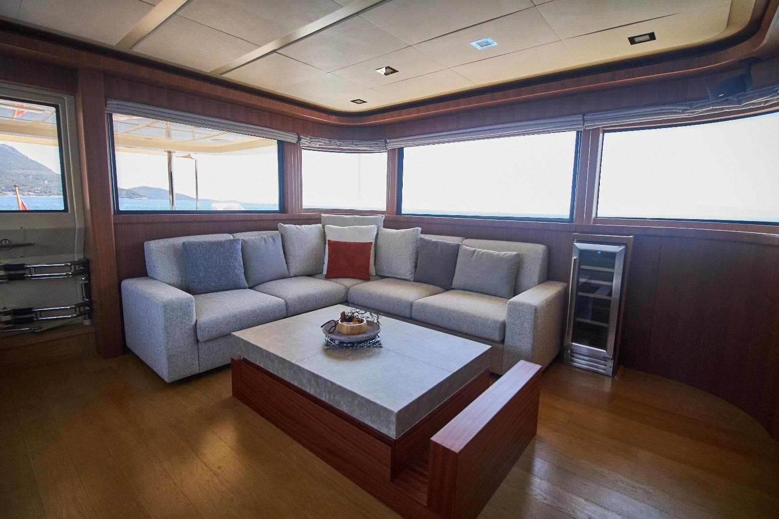 Luxurious yacht interior with a modern sofa and panoramic windows, Custom Line Navetta 33, 2010.