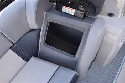 2026 Princecraft Quorum 25 RL boat seat storage compartment, gray upholstery.