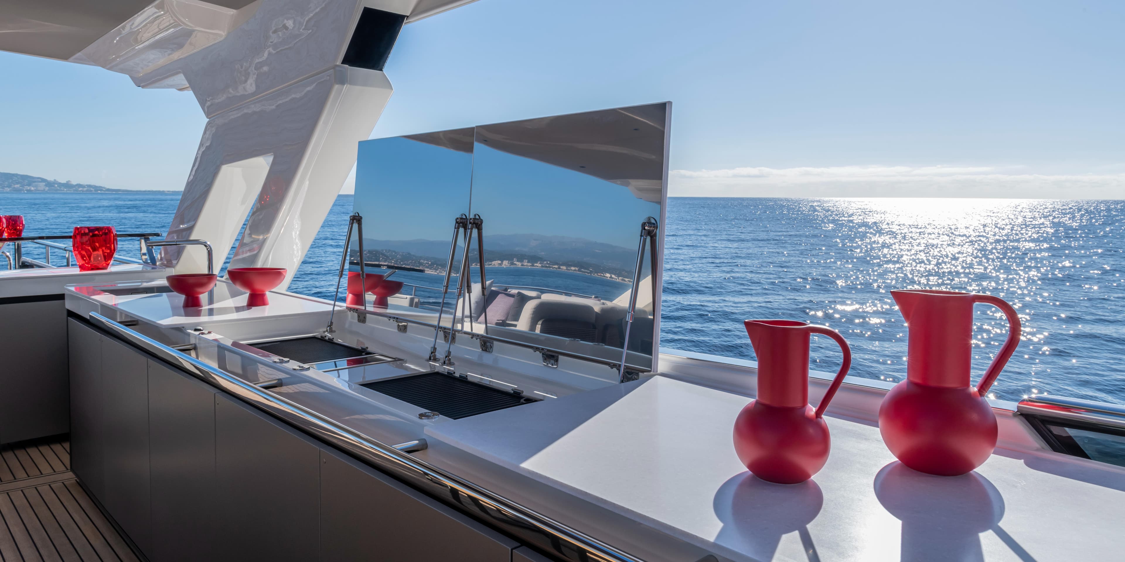Luxury yacht Absolute NAVETTA 75, 2025 model, featuring a sleek outdoor kitchen with ocean view.