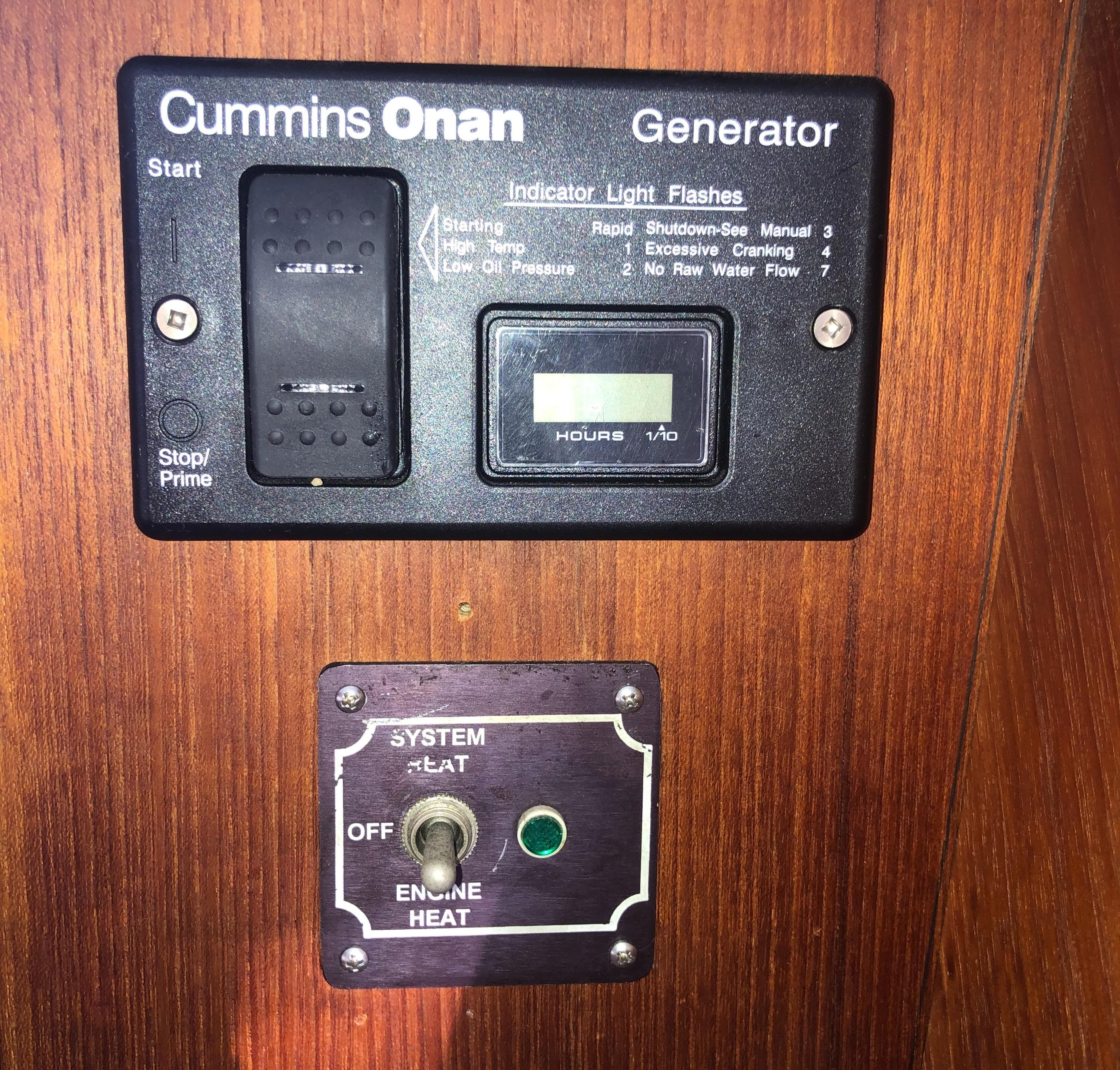 Control panel of a Cummins Onan generator on a 1996 Bayliner 4788 yacht.