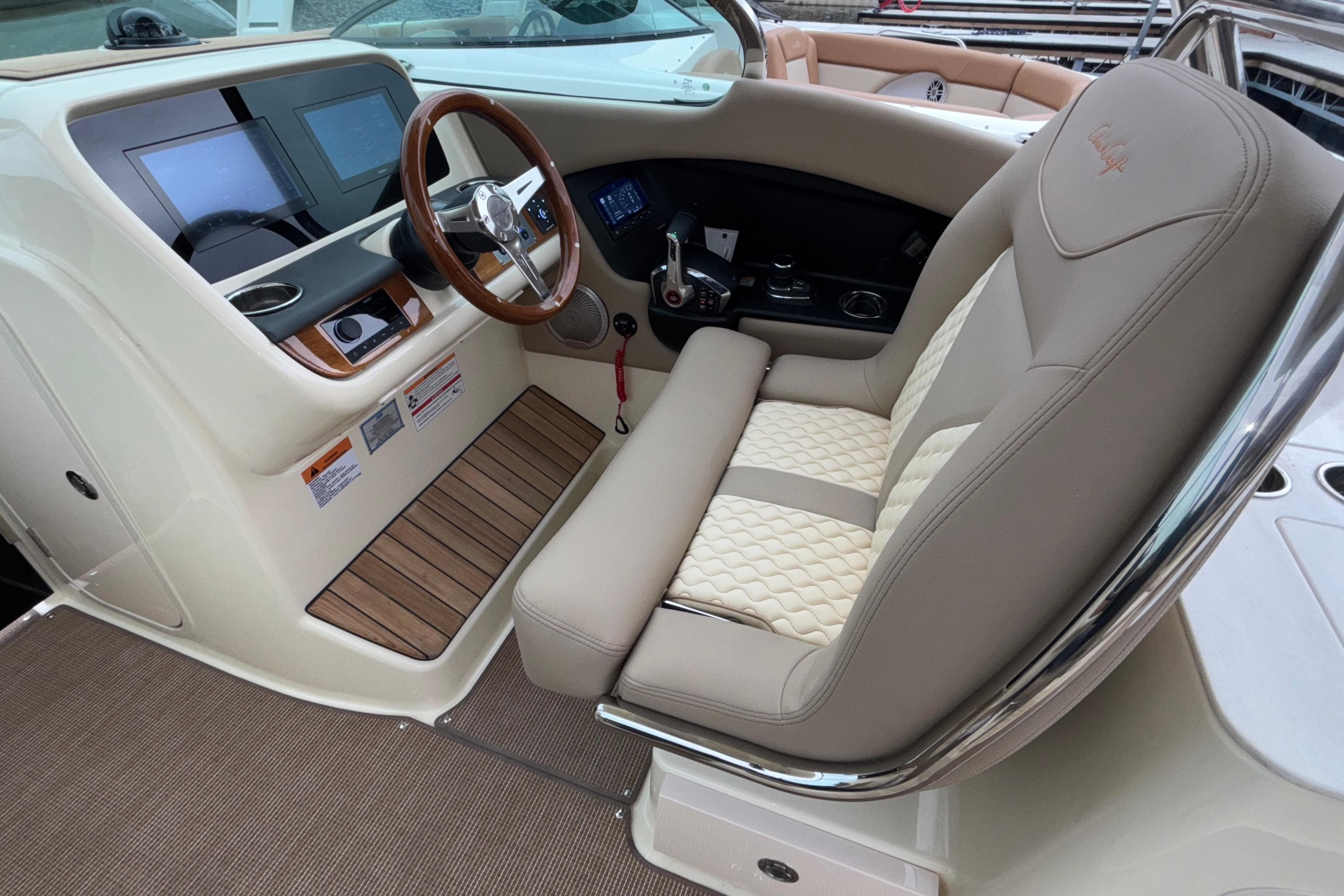 2026 Chris-Craft Calypso 28 helm with luxurious seating and modern dashboard controls.