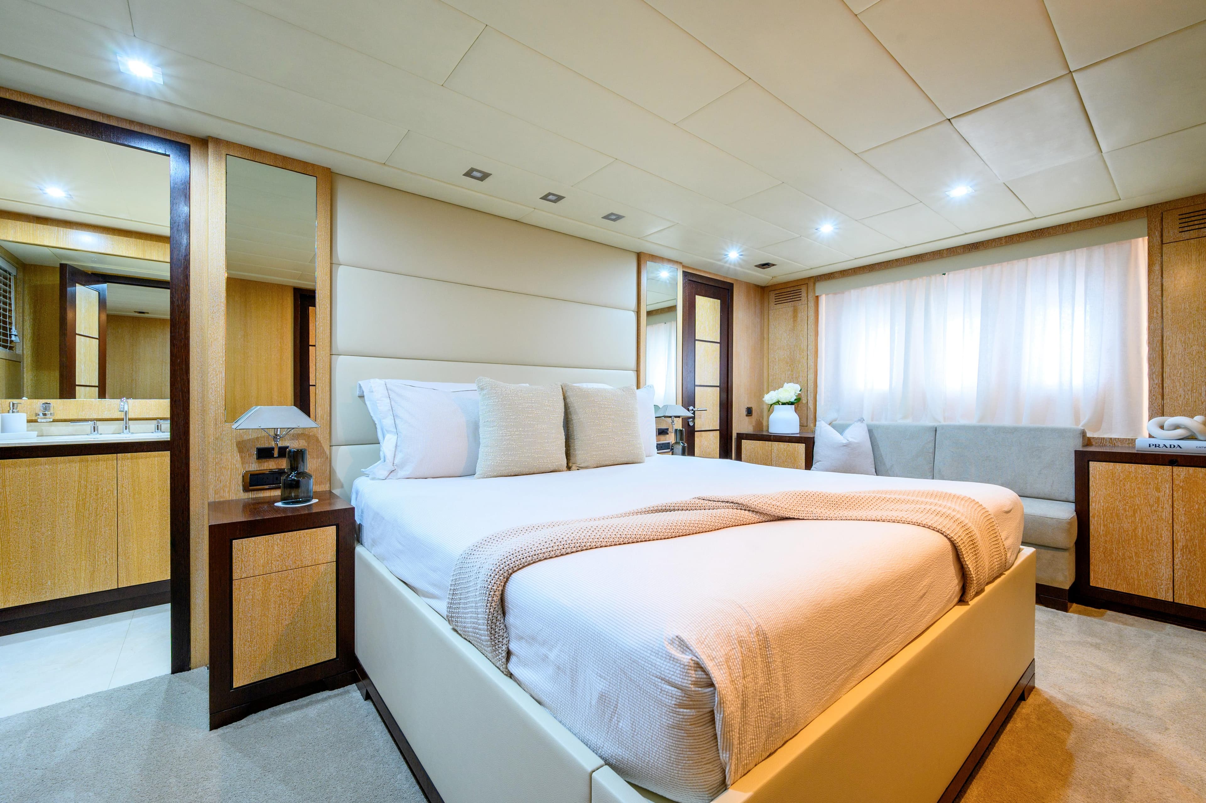 Luxurious bedroom interior on 2007 Mangusta 80 yacht, featuring elegant decor and modern amenities.