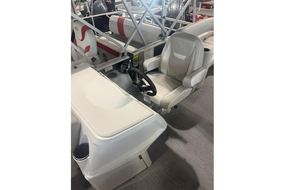 Captain's seat and helm of 2026 Godfrey Xperience 2286 SBX Sport Tube boat.