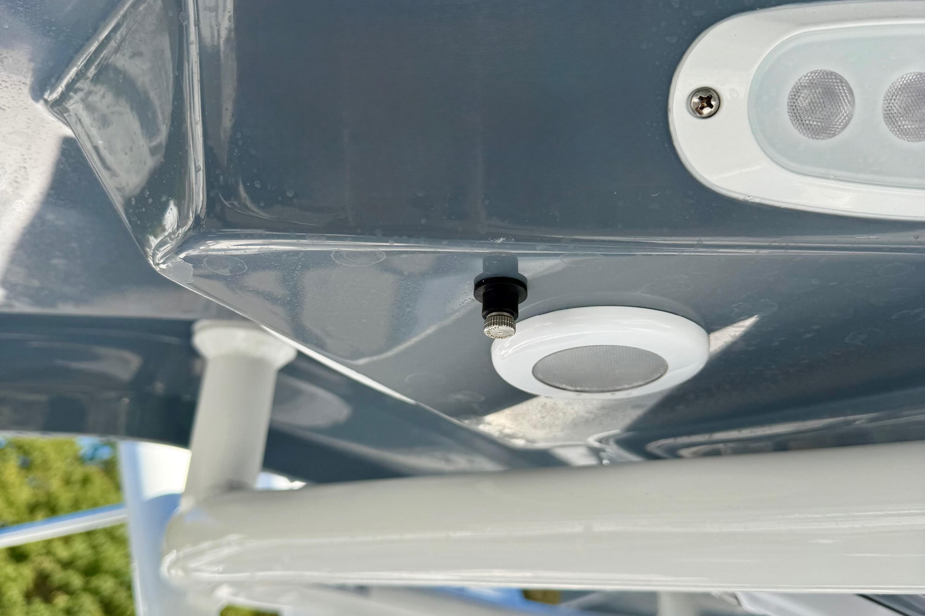 Close-up of 2026 Tidewater 282 CC Adventure boat's ceiling with light fixtures.