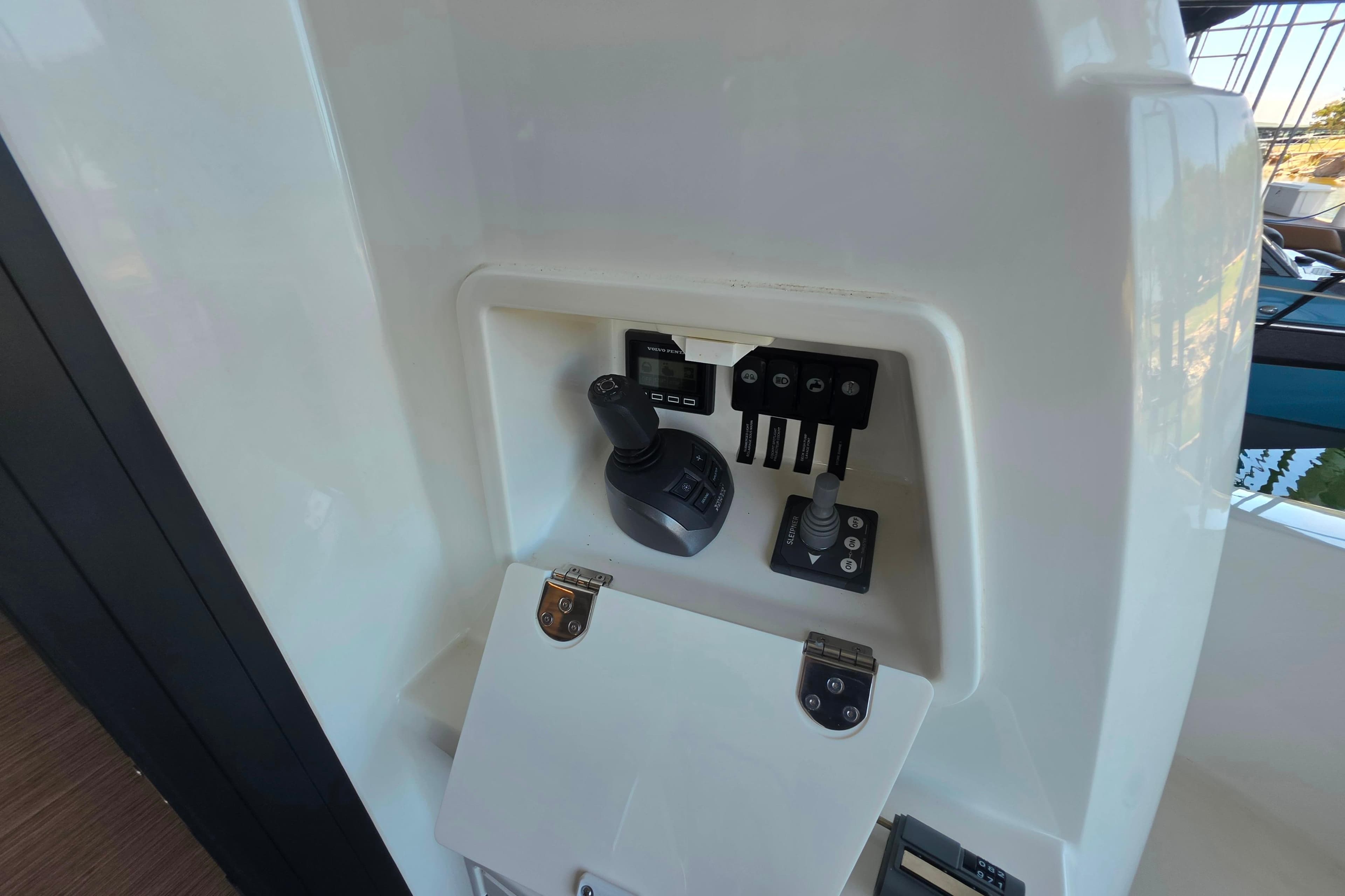 Control panel of 2025 Prestige 460 yacht, featuring joystick and switches.