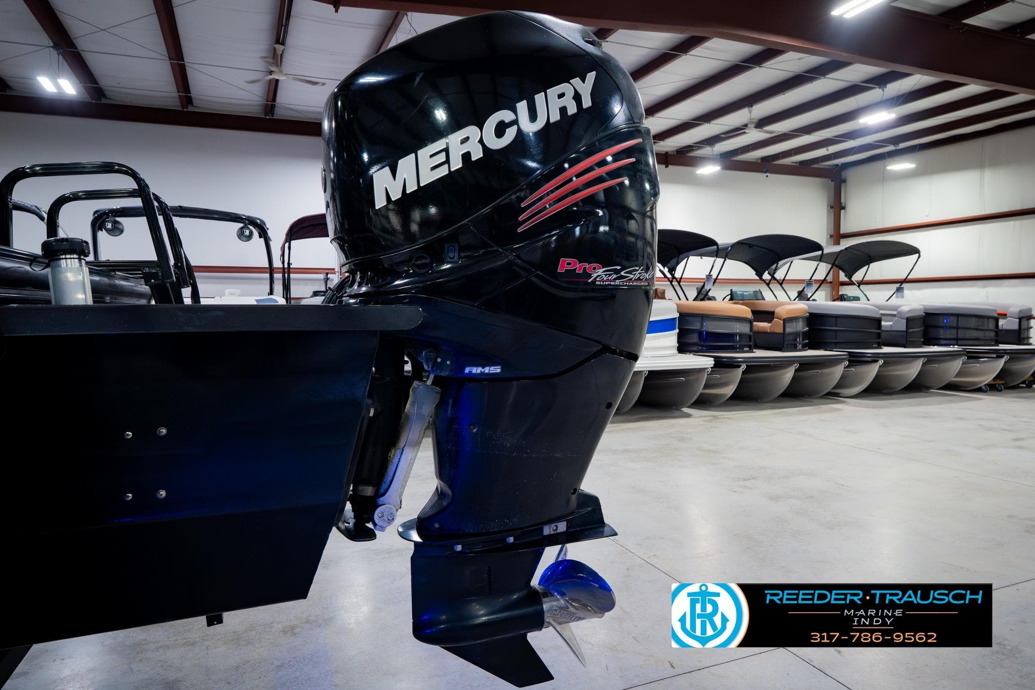 2018 Regency 254 DL3 with Mercury outboard motor in showroom.