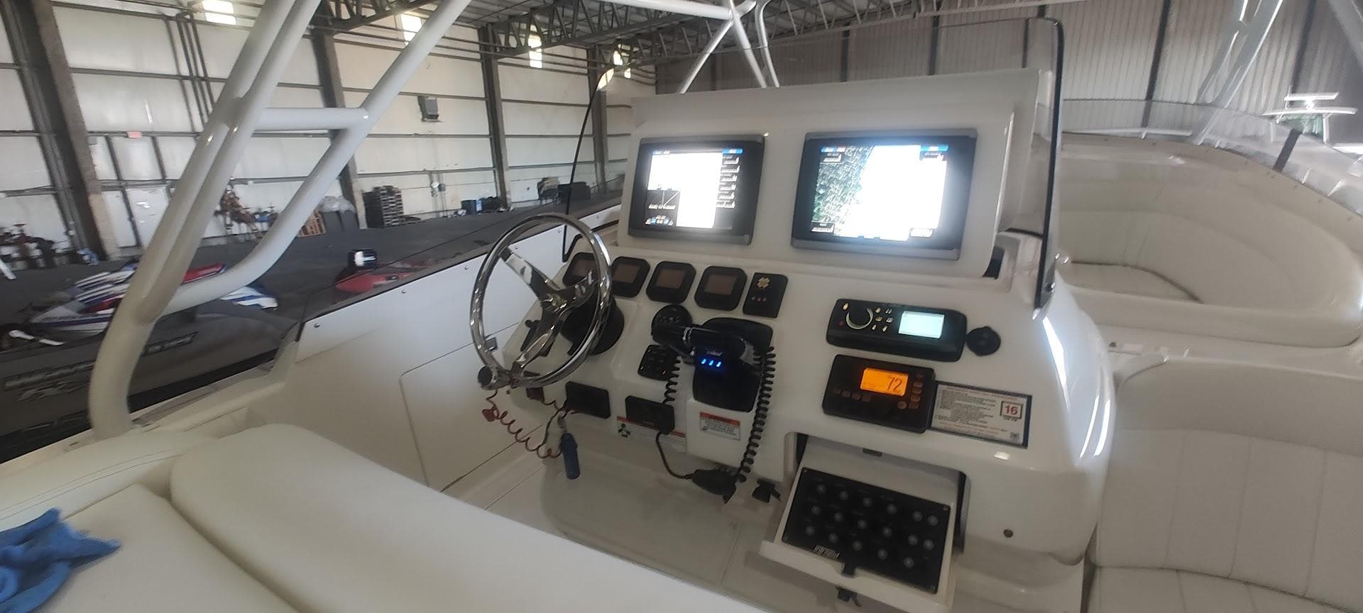 Cockpit of 2012 Intrepid 400 Cuddy with advanced navigation displays and controls.