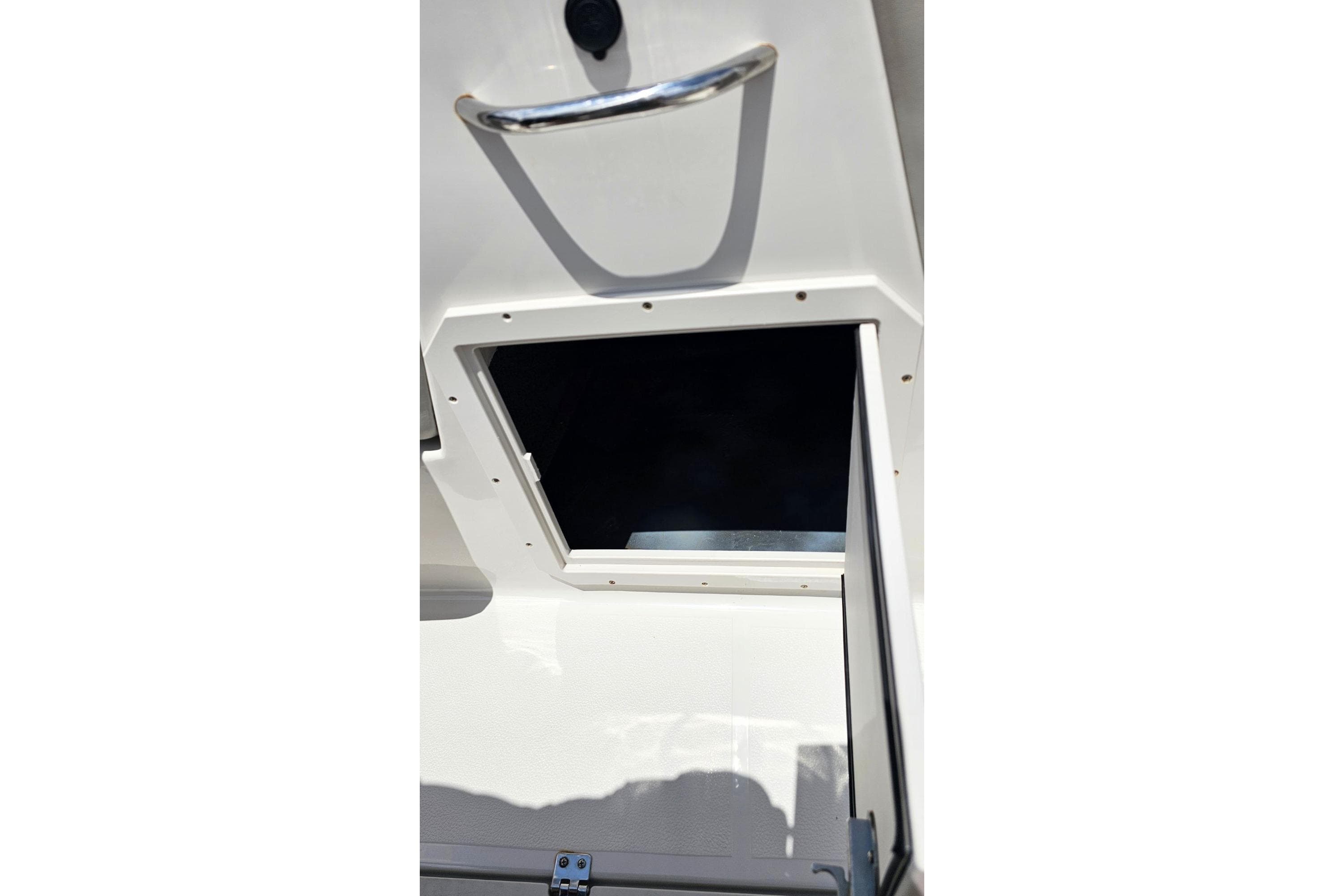 Open storage compartment on 2023 Starcraft SVX 211 OB boat.