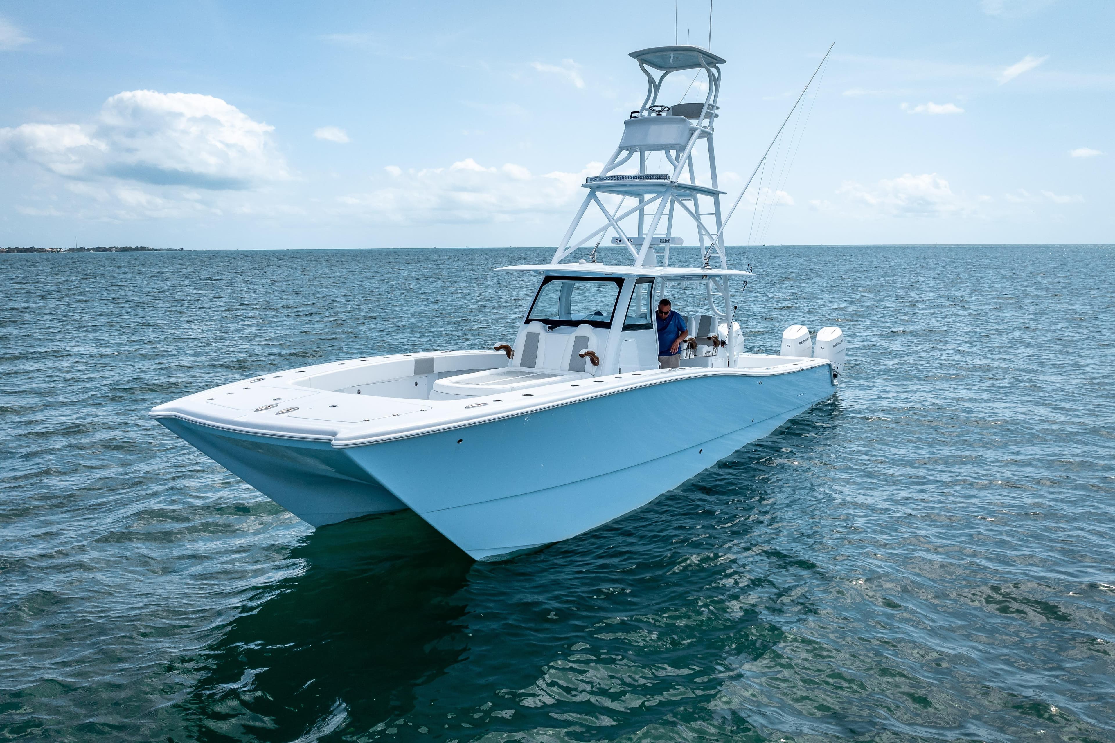 2025 Freeman 43 boat on open sea under clear sky.