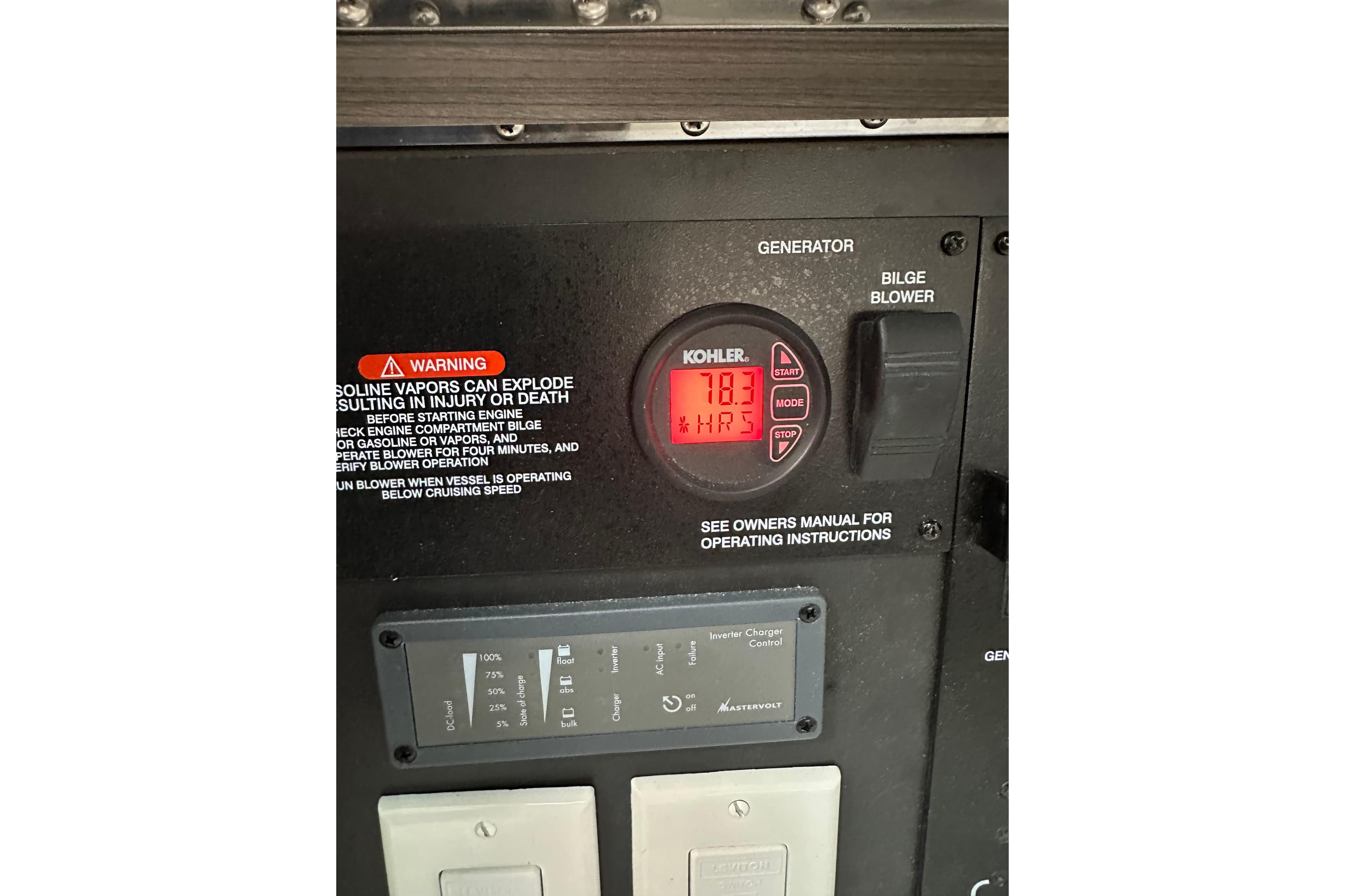 Control panel of a 2018 Sea Ray SLX 400 boat, featuring generator and bilge blower.