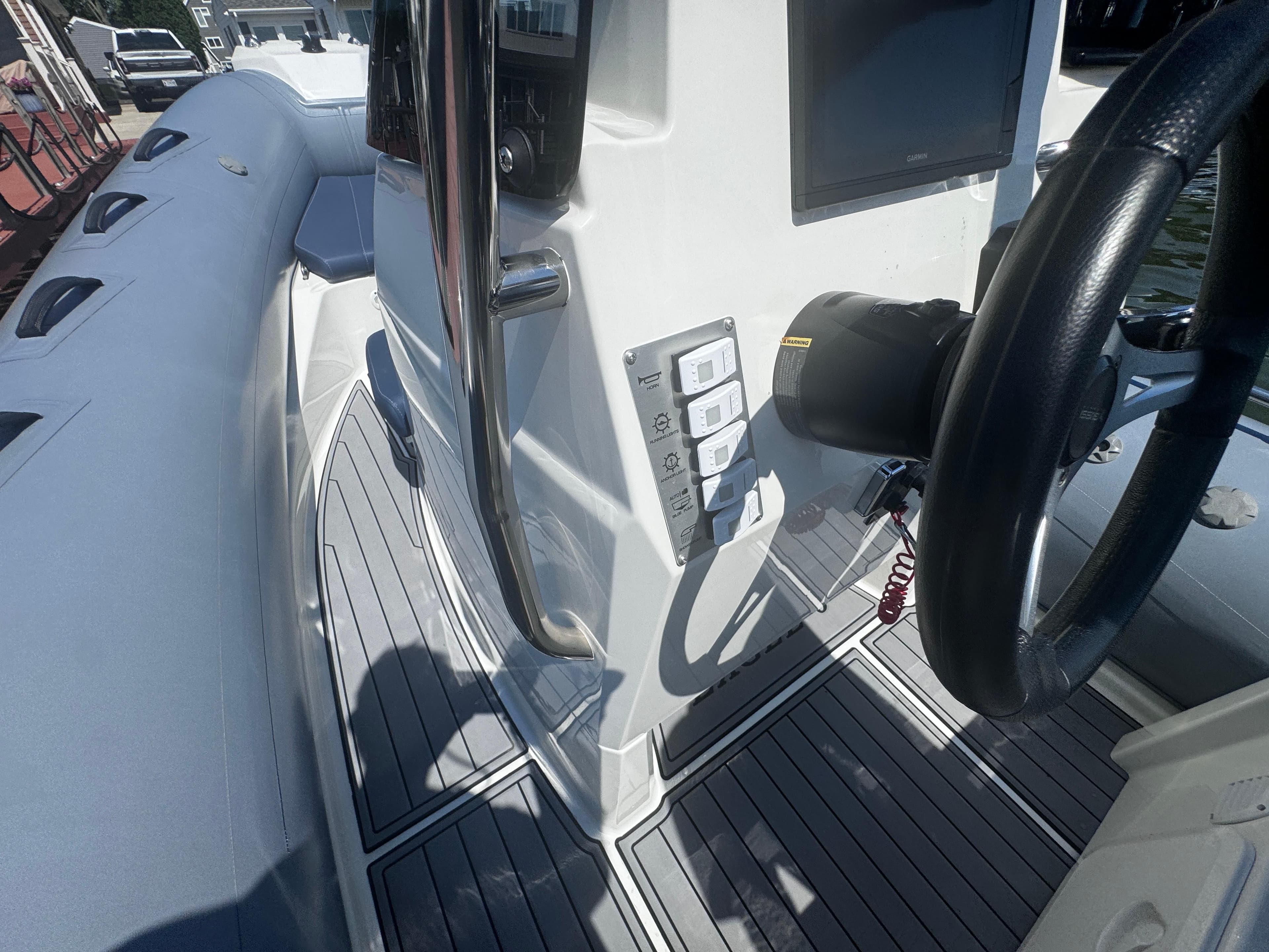 2022 Brig Eagle 6 boat interior with steering wheel and control panel.