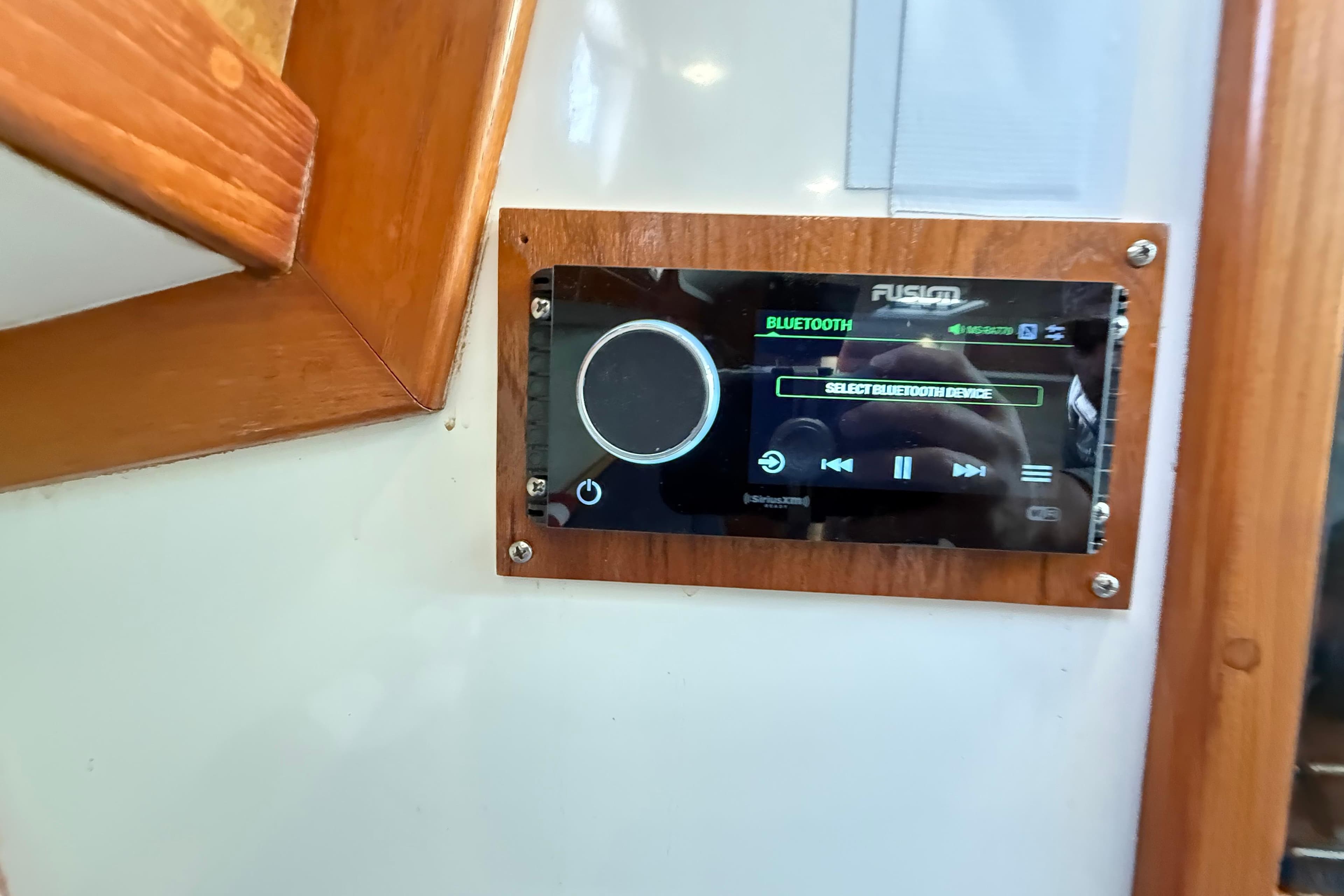 Fusion Bluetooth stereo system on 1996 Cabo 35 Express boat interior.