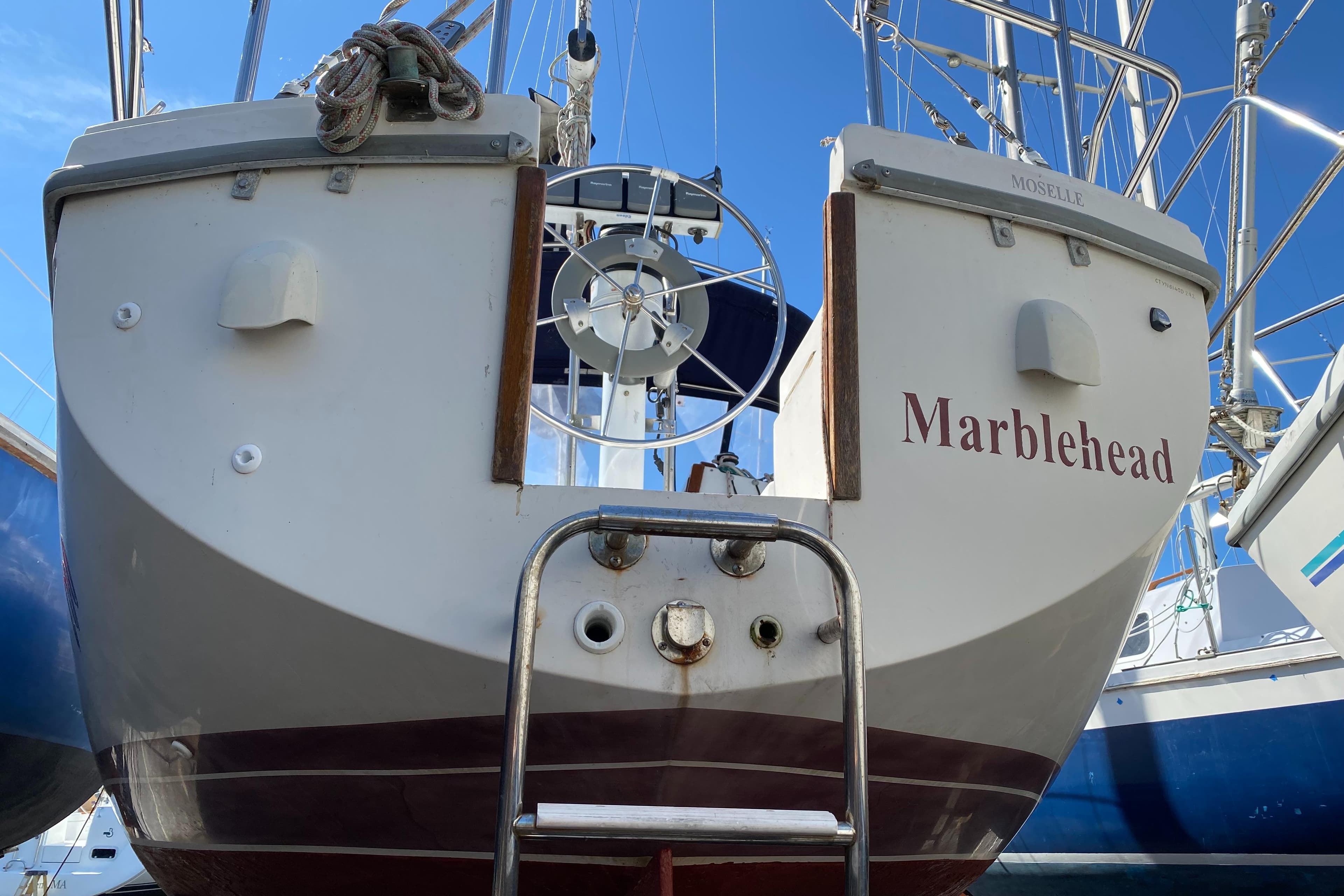 Catalina 30 MkII sailboat, 1992 model, named "Marblehead," docked with visible stern and ladder.