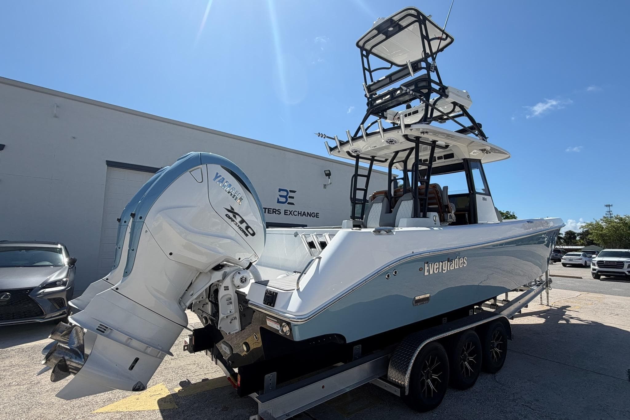 2024 Everglades 335 Center Console boat with Yamaha engine on trailer, outdoors.