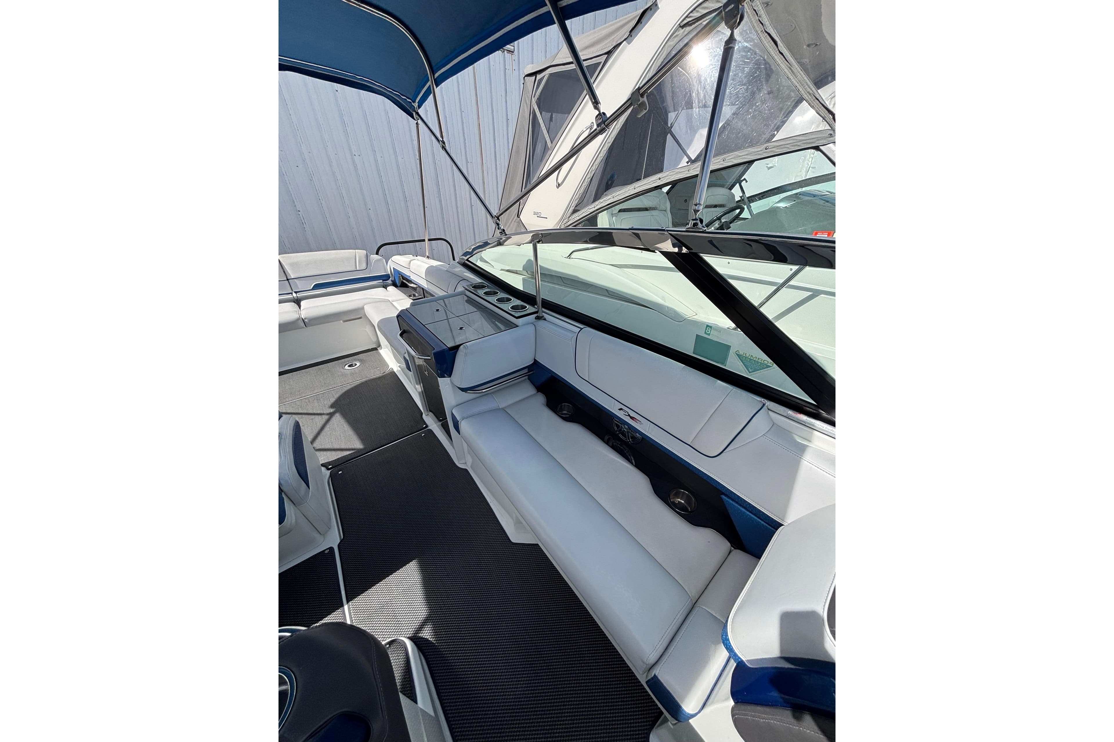2018 Formula 330 Crossover Bowrider I/O interior with seating and canopy.