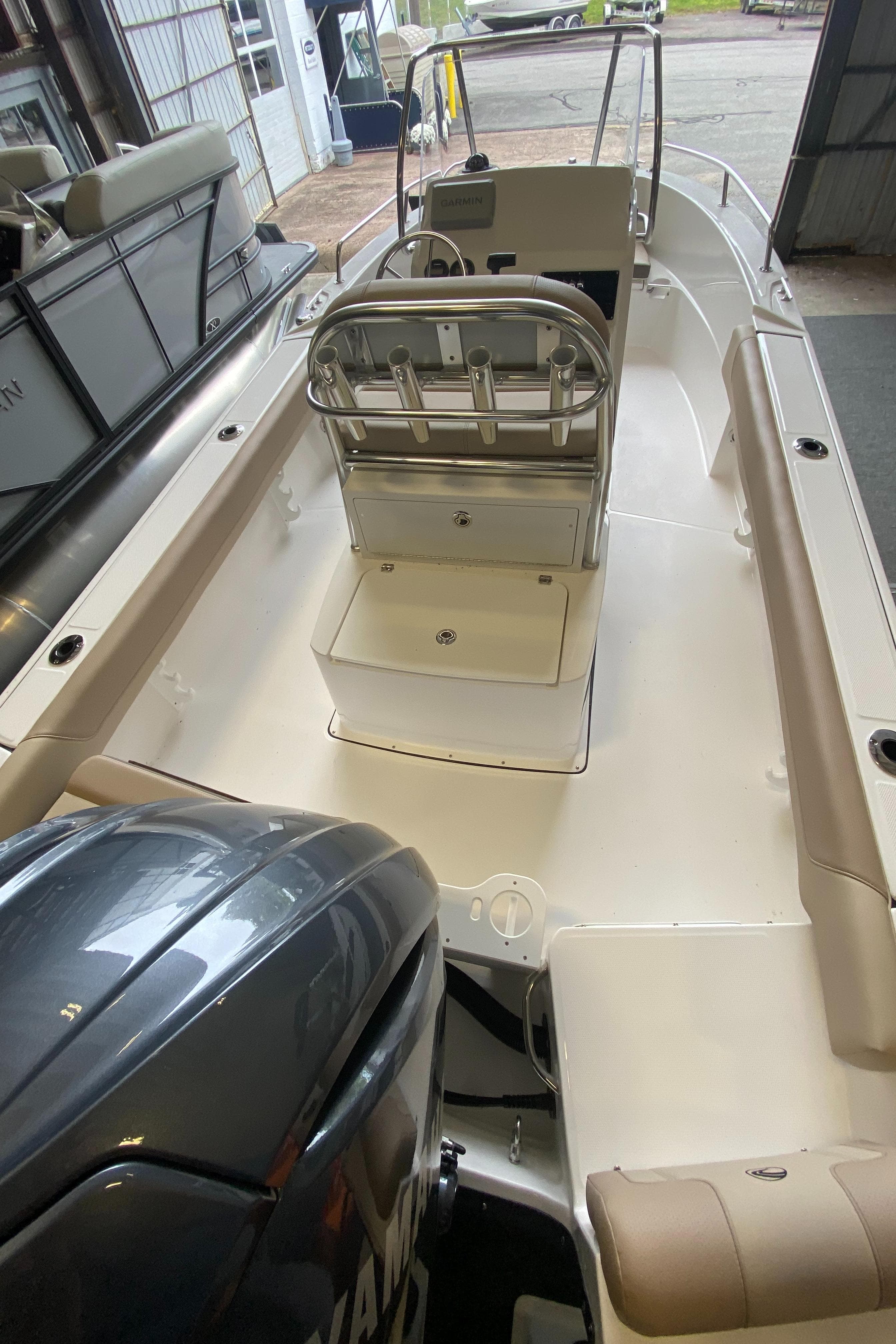 2024 Edgewater 188CC Center Console boat interior with seating and outboard motor.