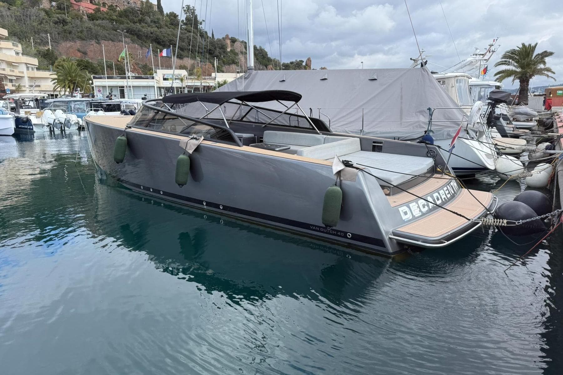 VanDutch 40 yacht, 2010 model, docked in a marina with scenic background.