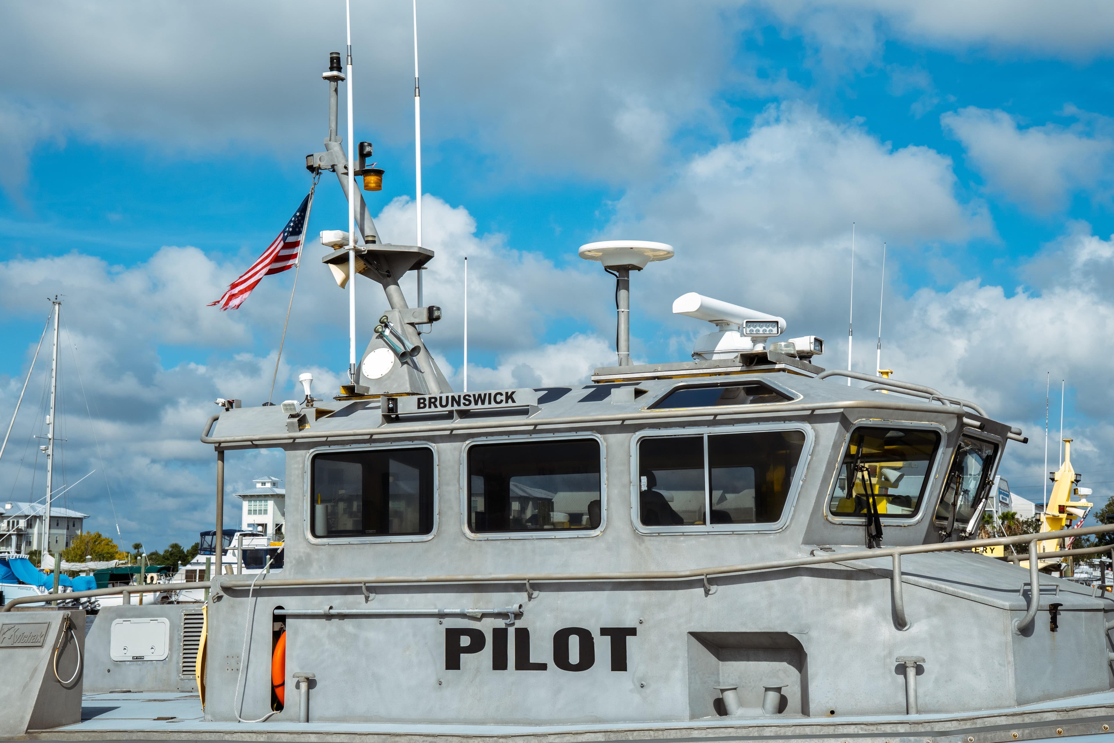 2004 Kvichak Marine Industries Pilot boat docked, featuring American flag and clear blue sky.
