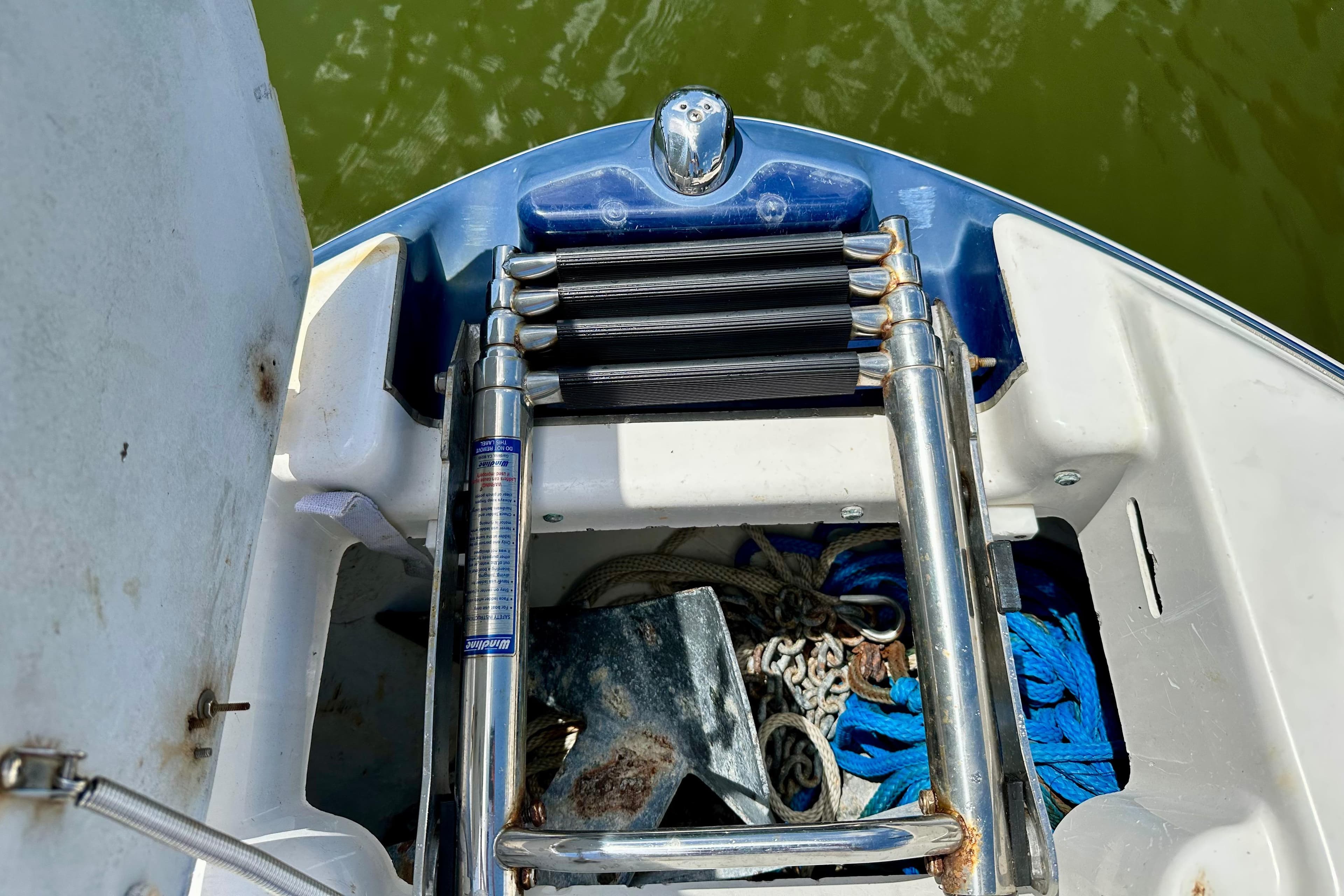 2011 Yamaha Boats 242 Limited anchor compartment with ladder and ropes.