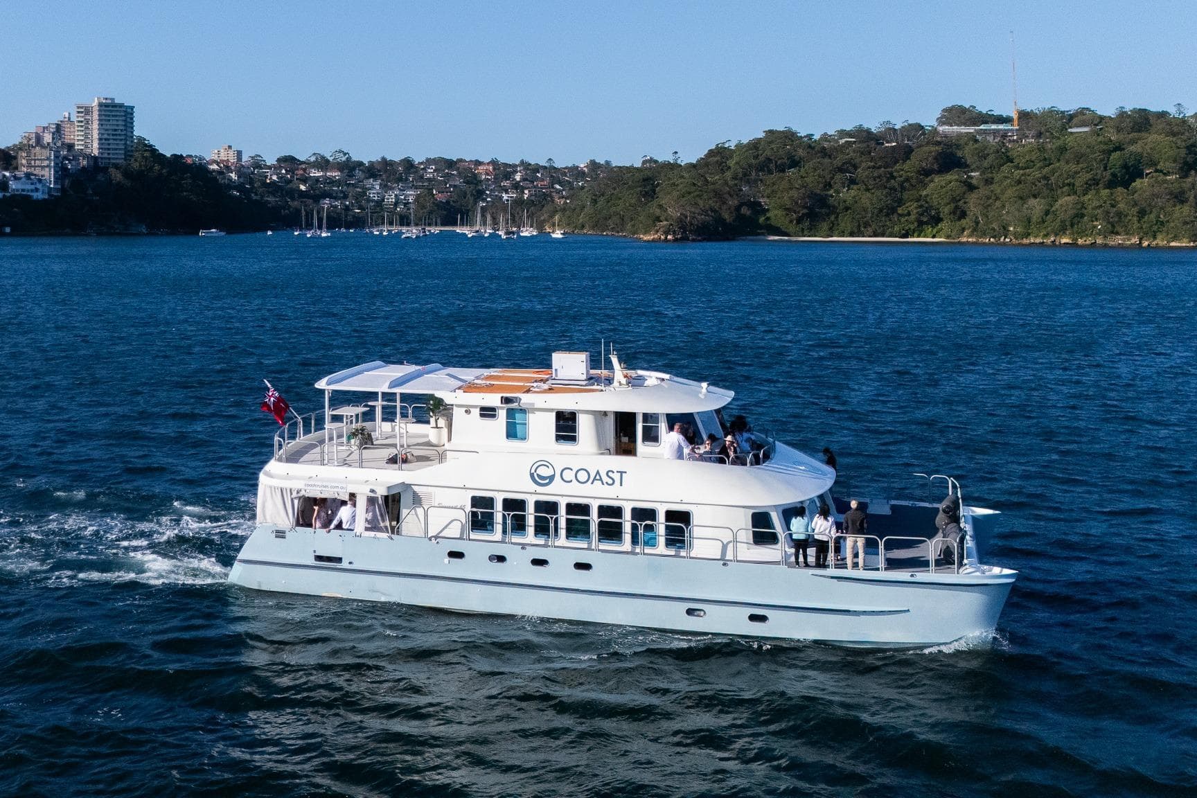 Luxury Suncoast 65 yacht cruising on blue waters, 2006 model.
