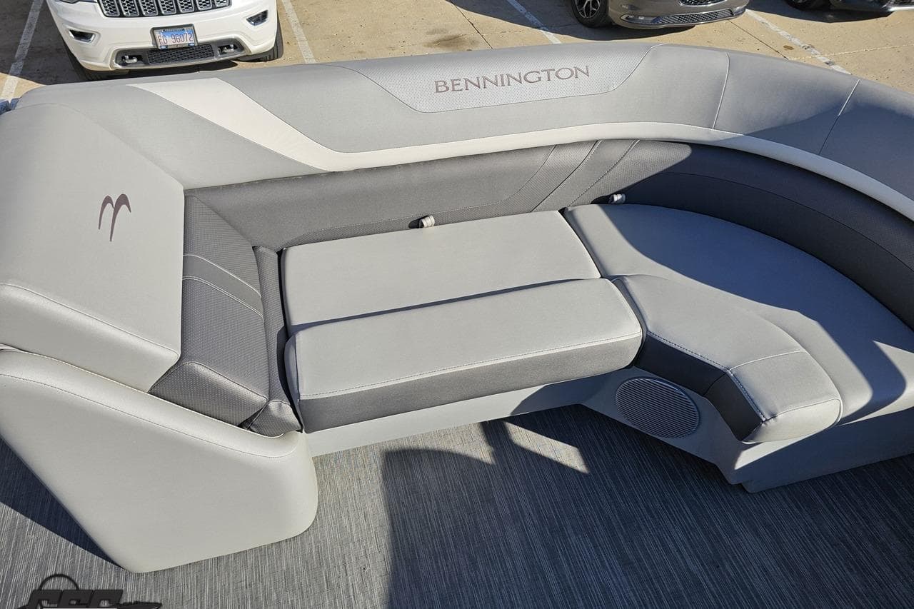 2022 Bennington SX 21 Fishing boat interior with gray cushioned seating.
