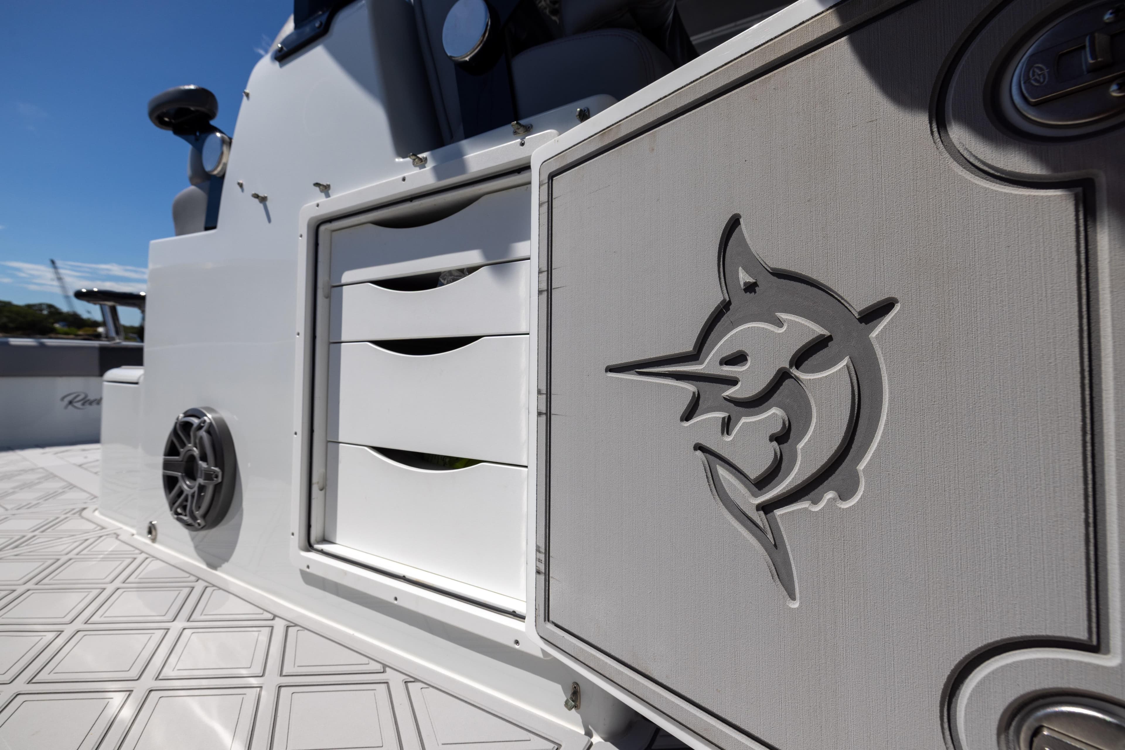 2023 Freeman 47 boat interior with marlin logo and storage drawers.