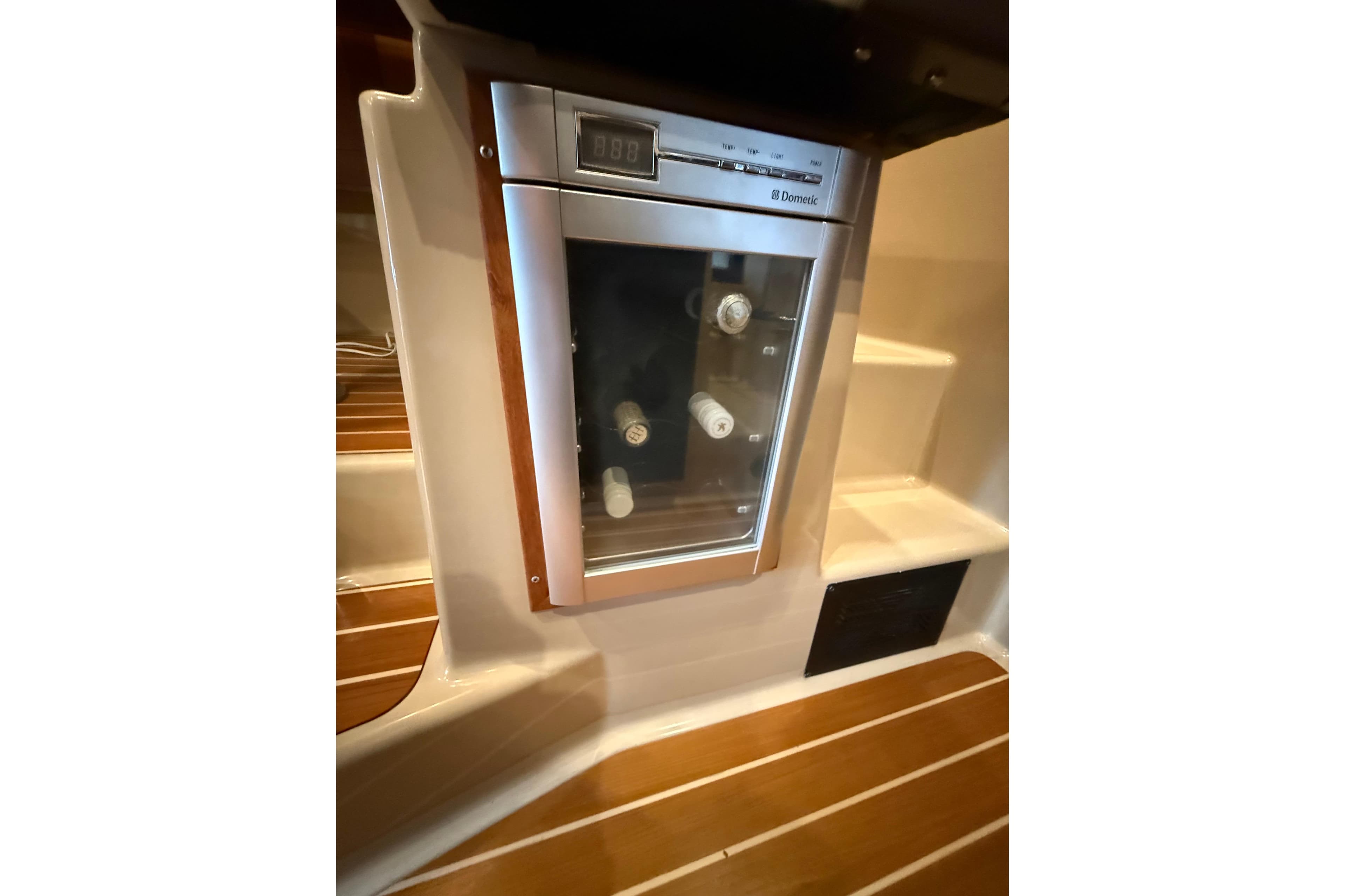 2016 Ranger Tugs R-31 CB interior with built-in Dometic wine cooler.