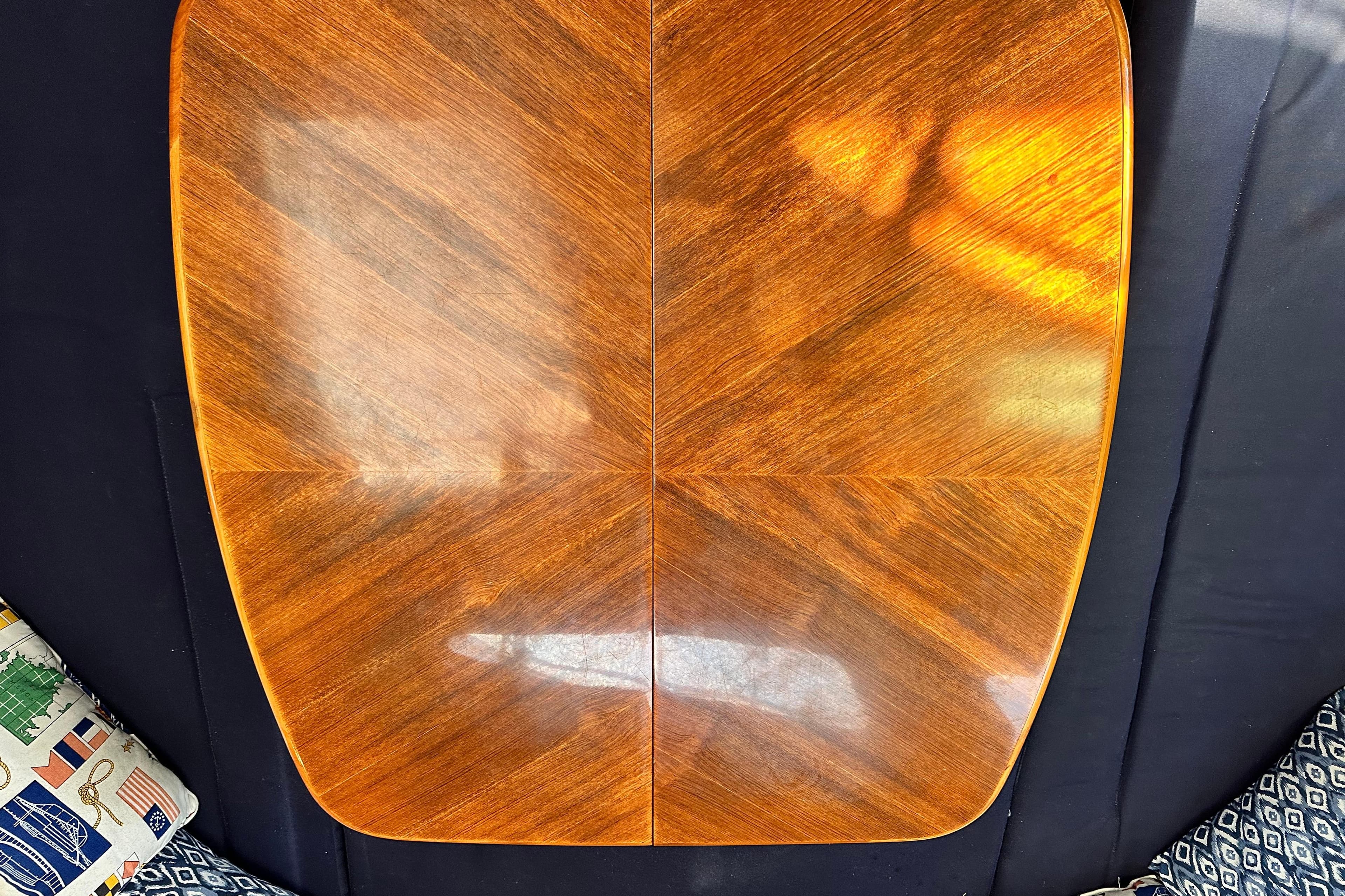 Polished wooden table on a Hunter 41 AC, 2005 model, with patterned cushions.