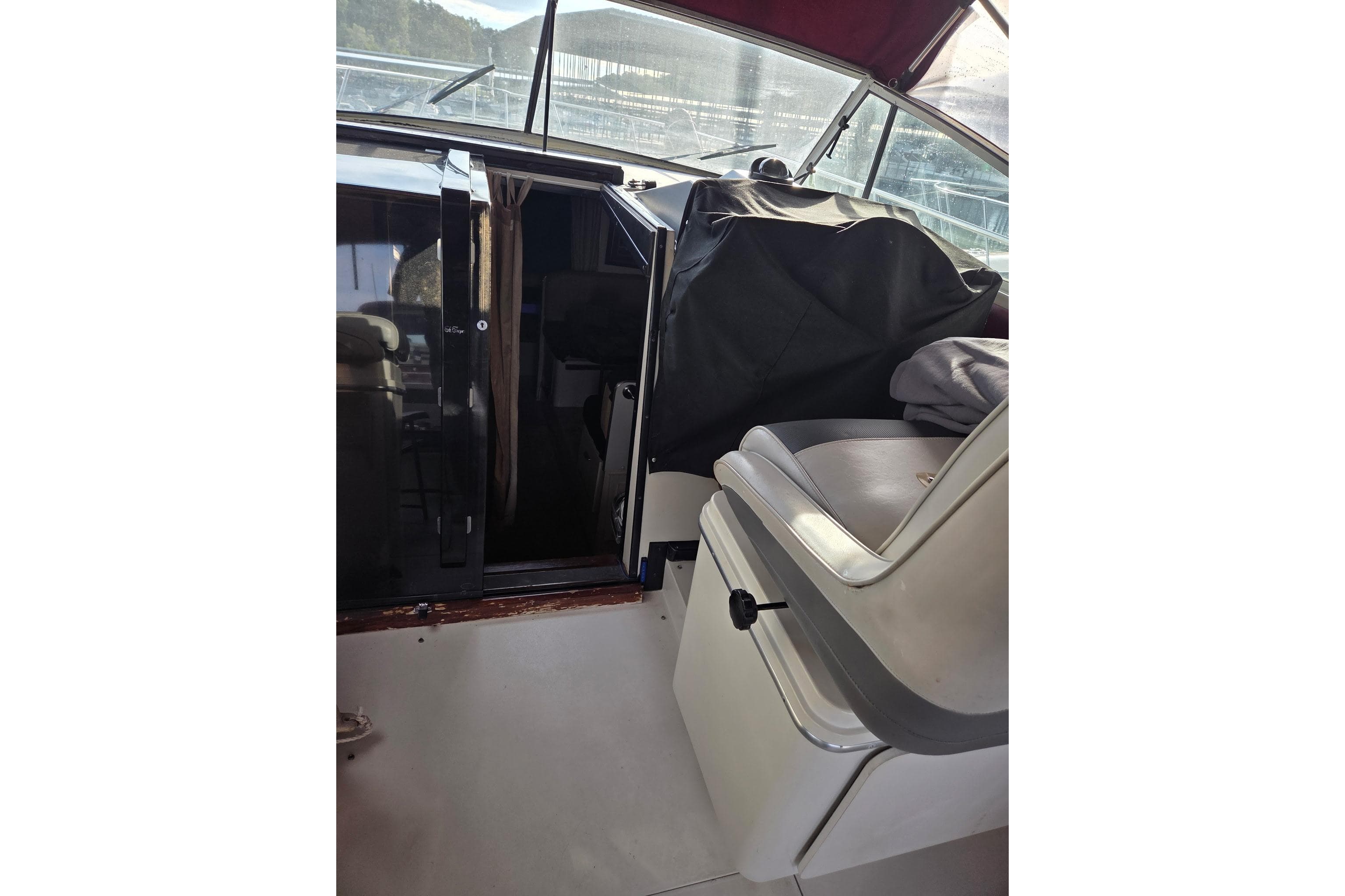 1988 Wellcraft 3200 St. Tropez boat interior with seating and cabin entrance.