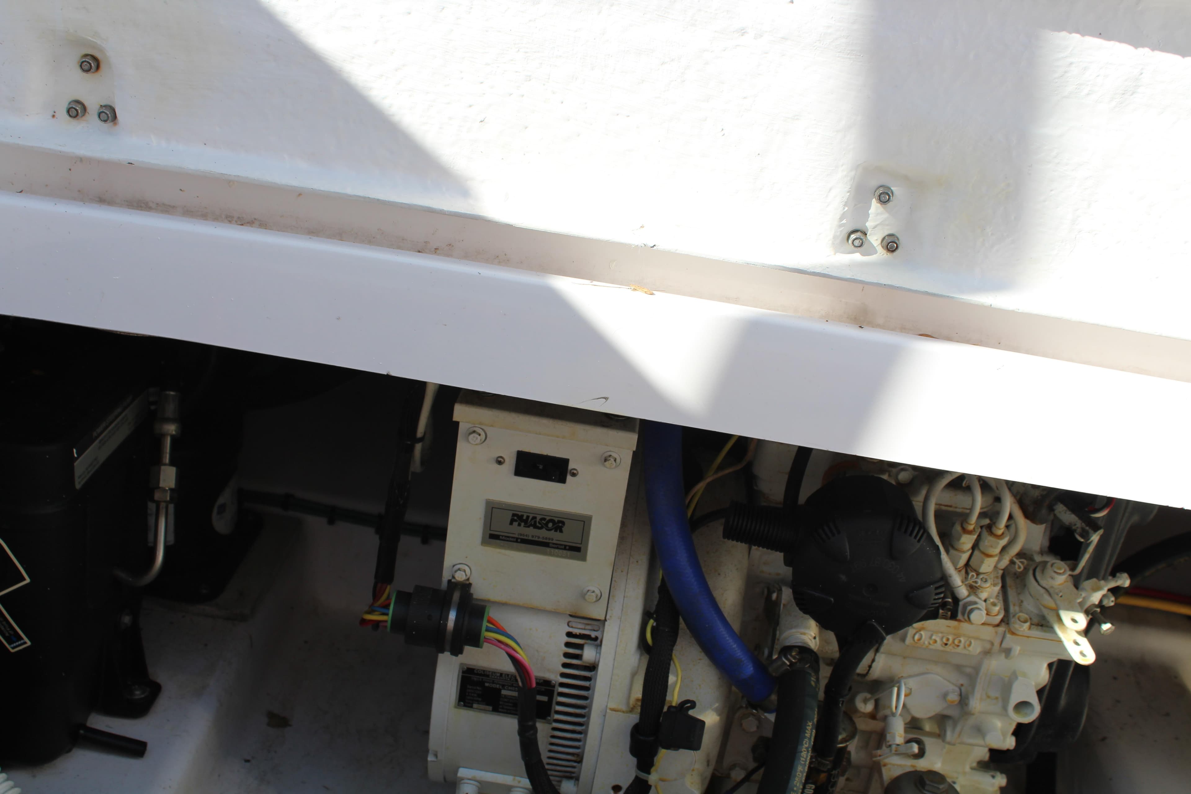 Engine compartment of 2006 Pro-Line 32 Express boat, showing mechanical components.