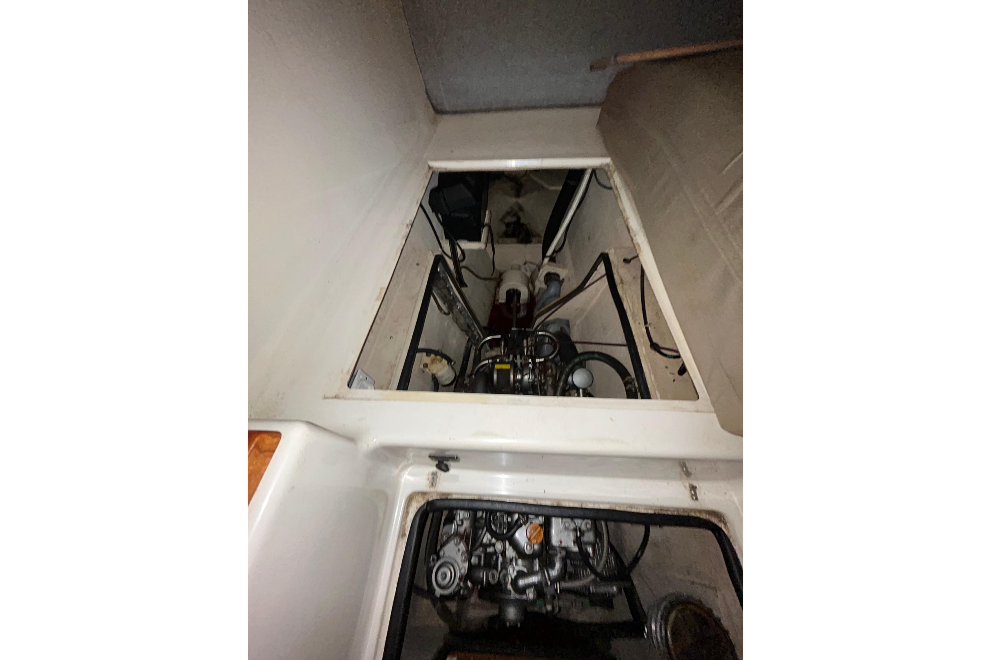 Engine compartment of 2004 PDQ 34 Power Catamaran, showcasing mechanical components.