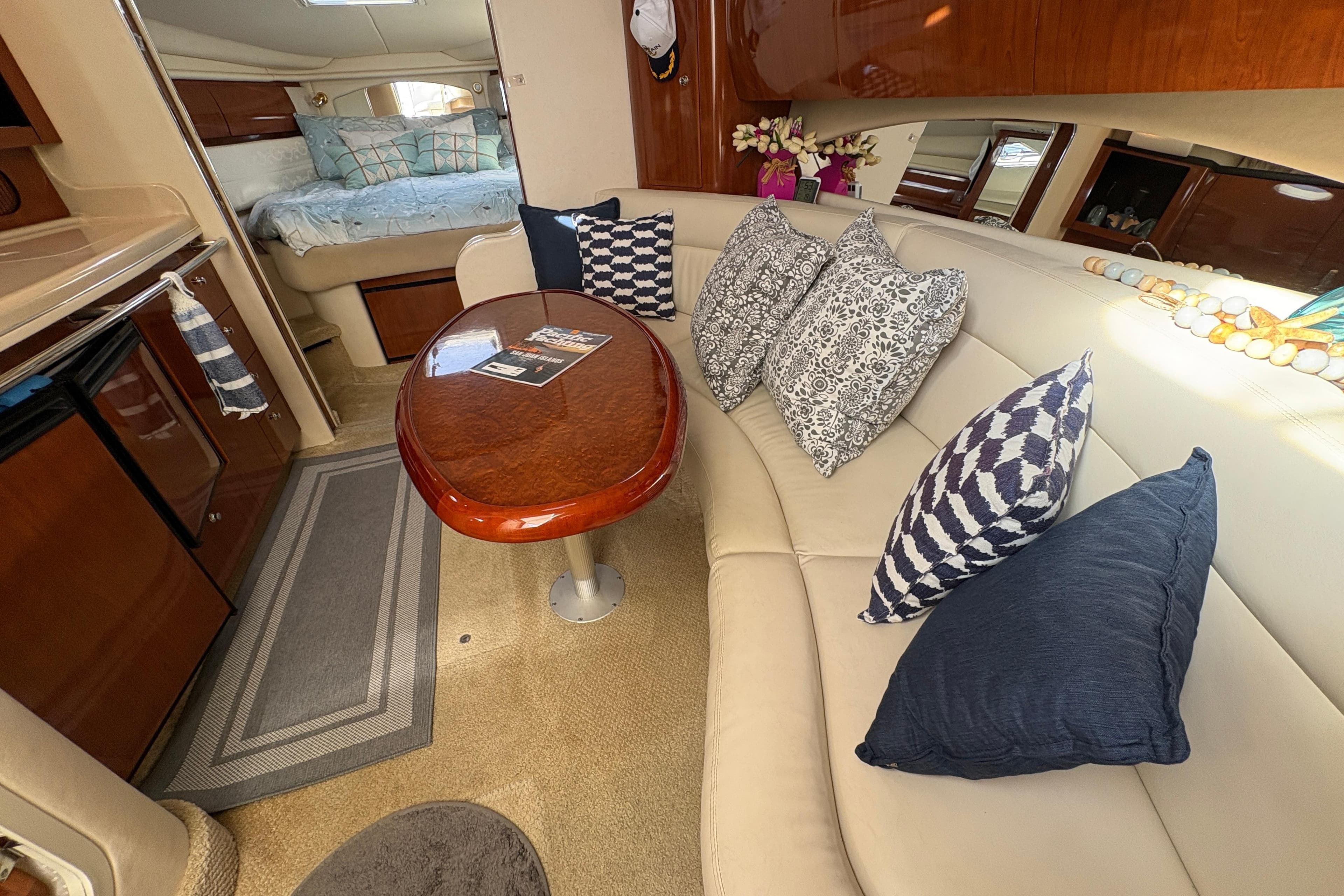 Luxurious interior of 2003 Sea Ray 360 Sundancer with plush seating and elegant decor.