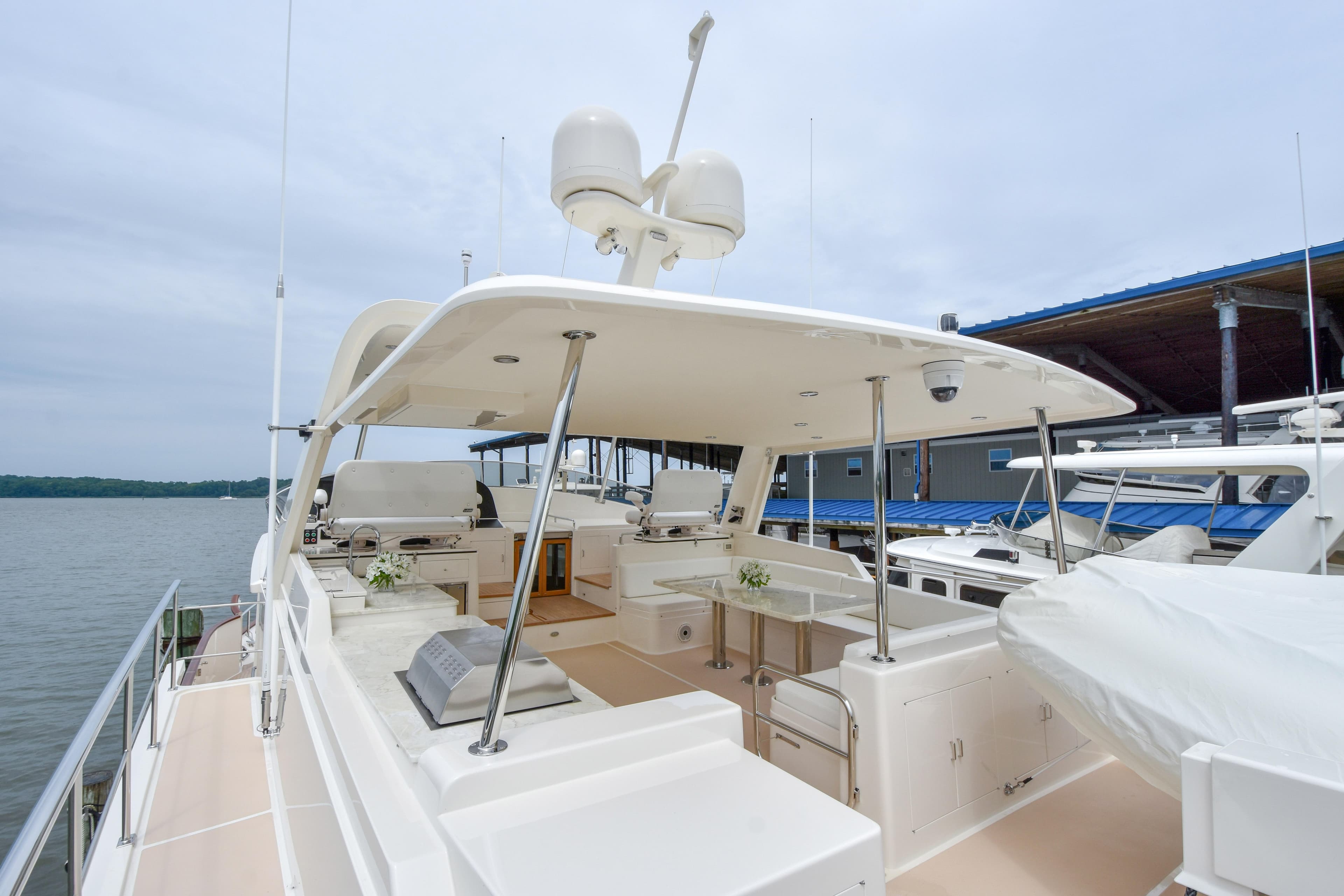 Luxury Fleming 78 yacht, 2020 model, docked with spacious deck and modern amenities.