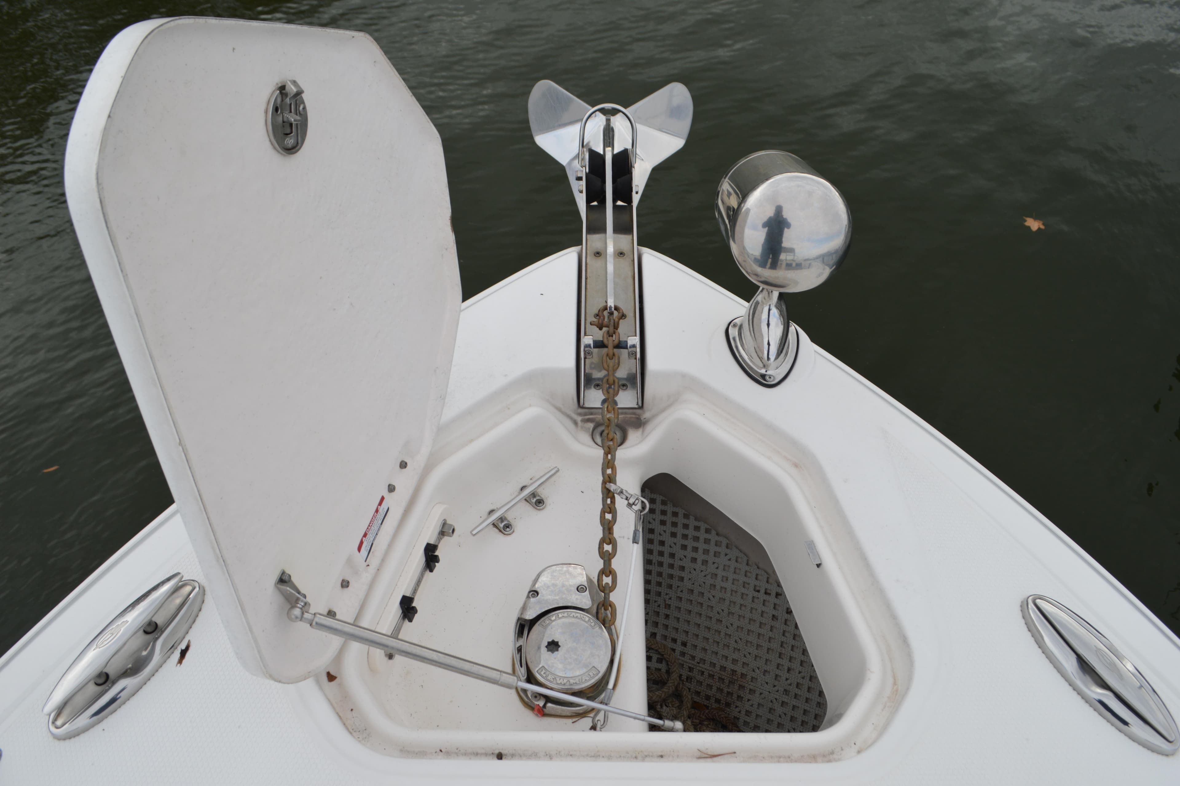 2013 Chaparral 327 SSX boat anchor compartment with open hatch and chain.