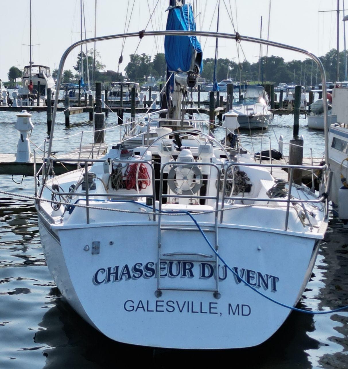 1987 Hunter 34 sailboat "Chasseur du Vent" docked in Galesville, MD marina.