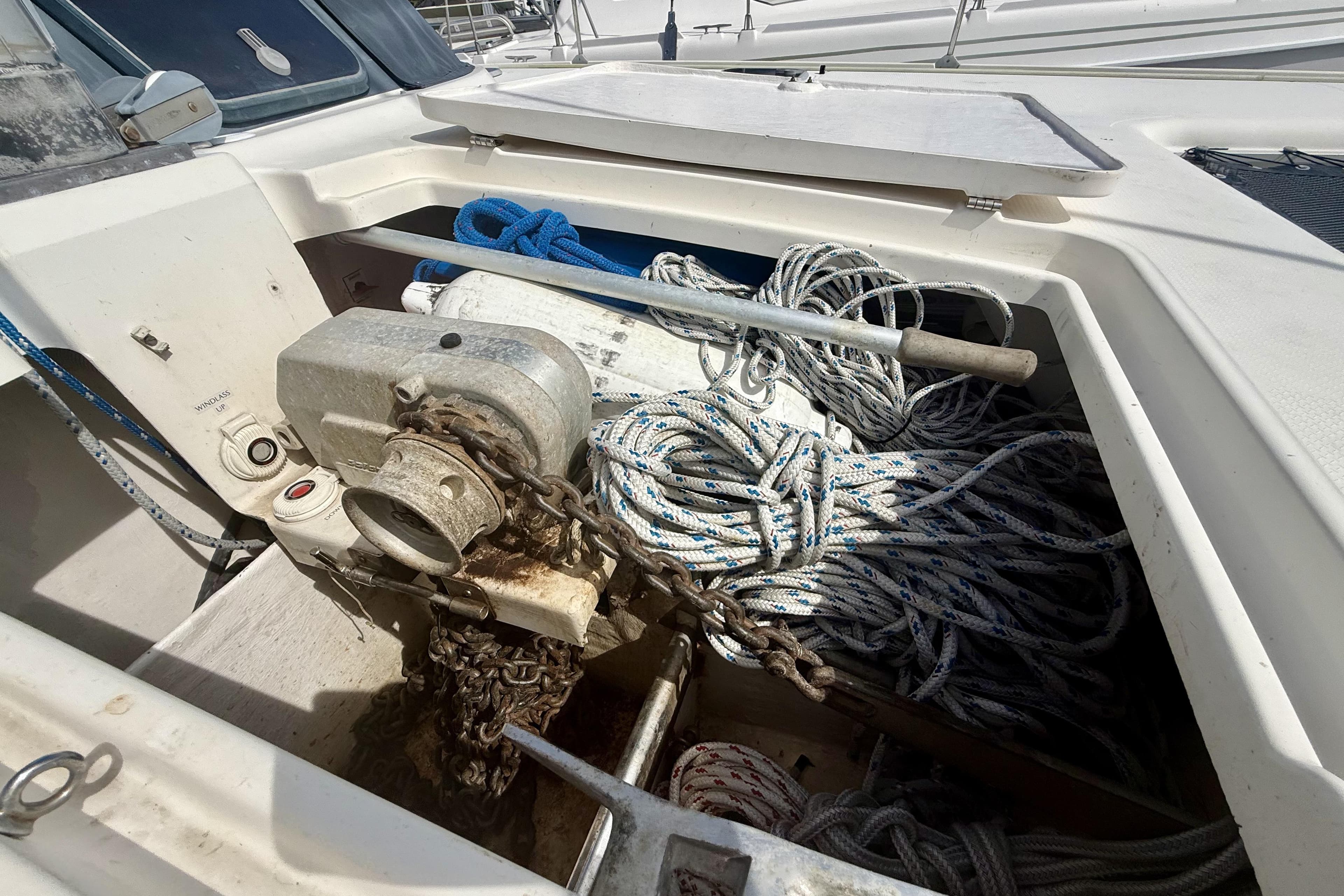 Anchor locker of 1995 Fountaine Pajot Athena 38 with ropes and chains.