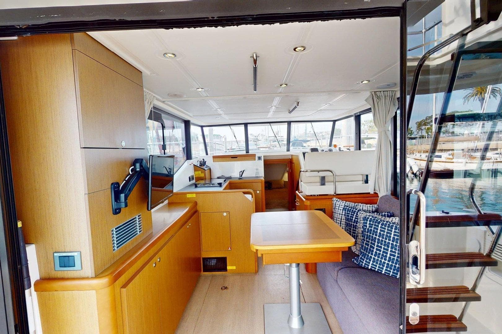 Interior of 2021 Beneteau Swift Trawler 35, featuring modern wood finishes and comfortable seating.