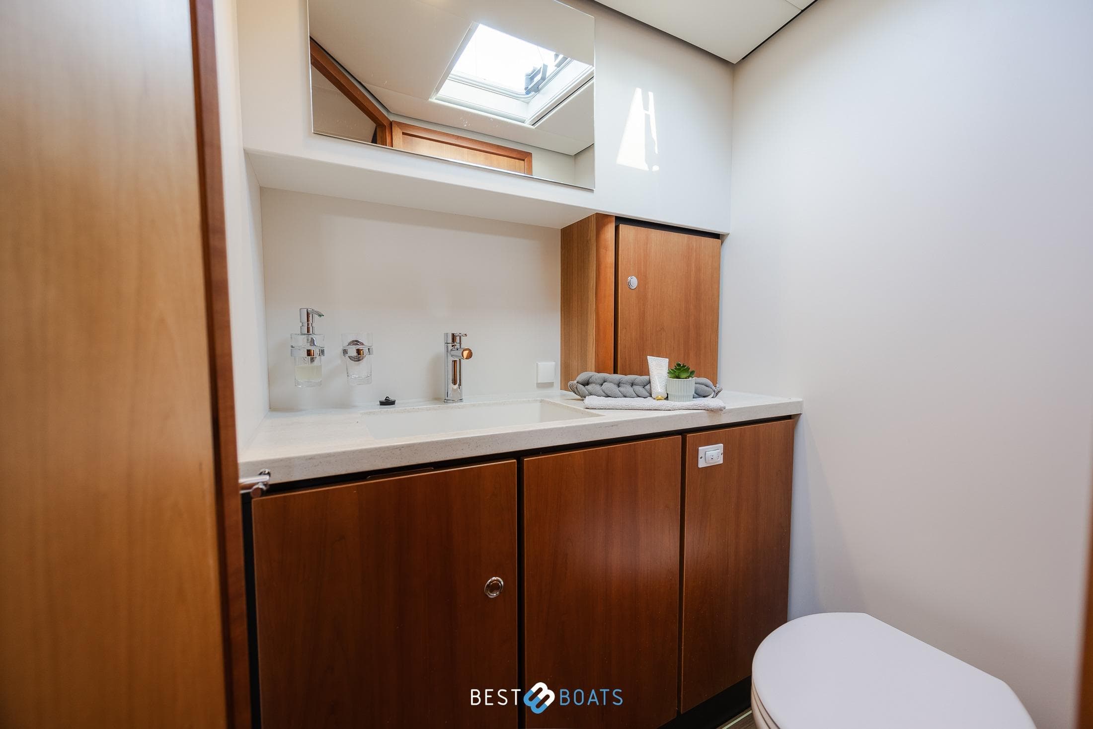 Bathroom interior of 2019 Linssen Grand Sturdy 40.0 AC yacht, featuring wooden cabinetry.