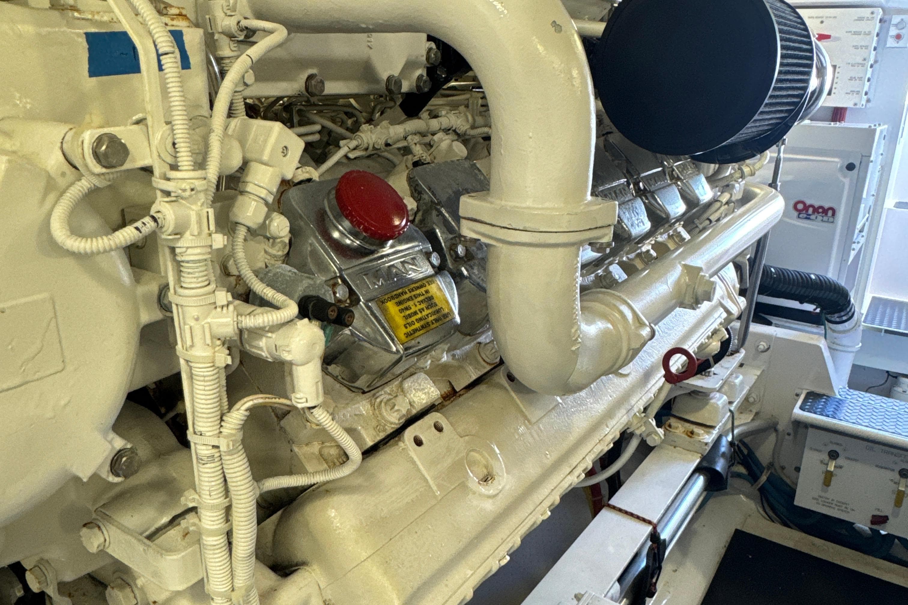 Engine room of 2006 Viking 56 Convertible yacht, featuring detailed mechanical components.