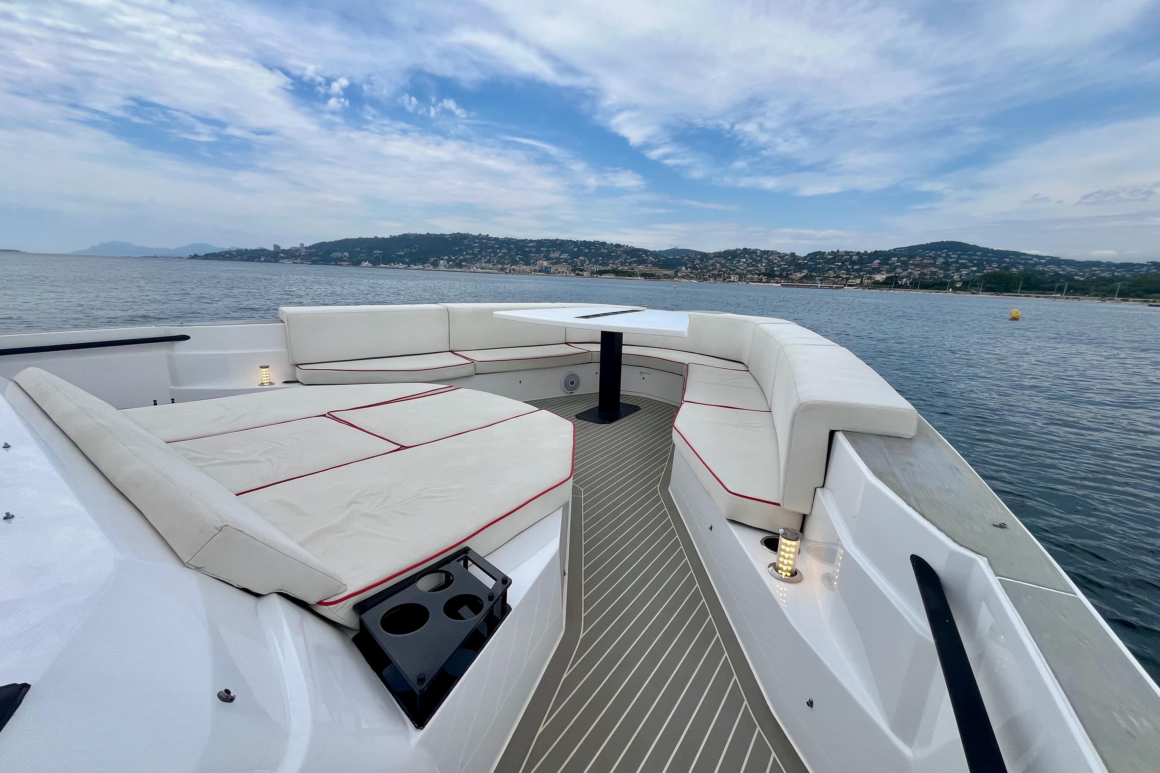 Luxurious 2021 OKEAN 55 yacht deck with elegant seating and scenic ocean view.