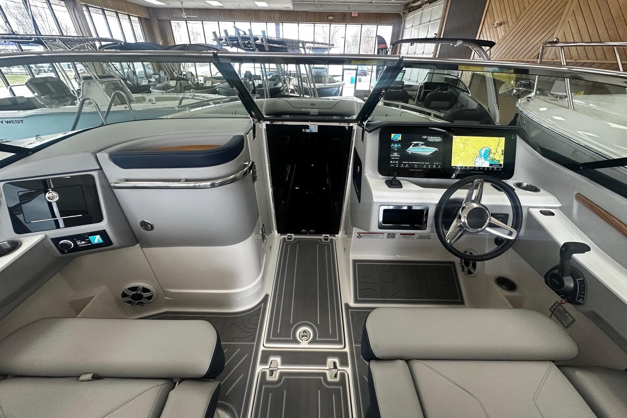 Interior of 2026 Regal LS9 boat with modern dashboard and navigation screens.