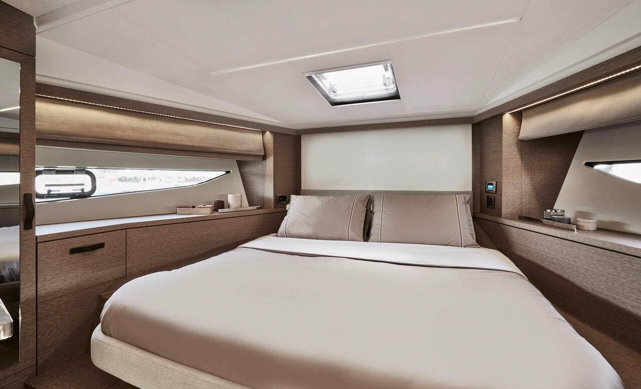 Luxurious bedroom interior of 2024 Prestige 420 Fly yacht with modern design.