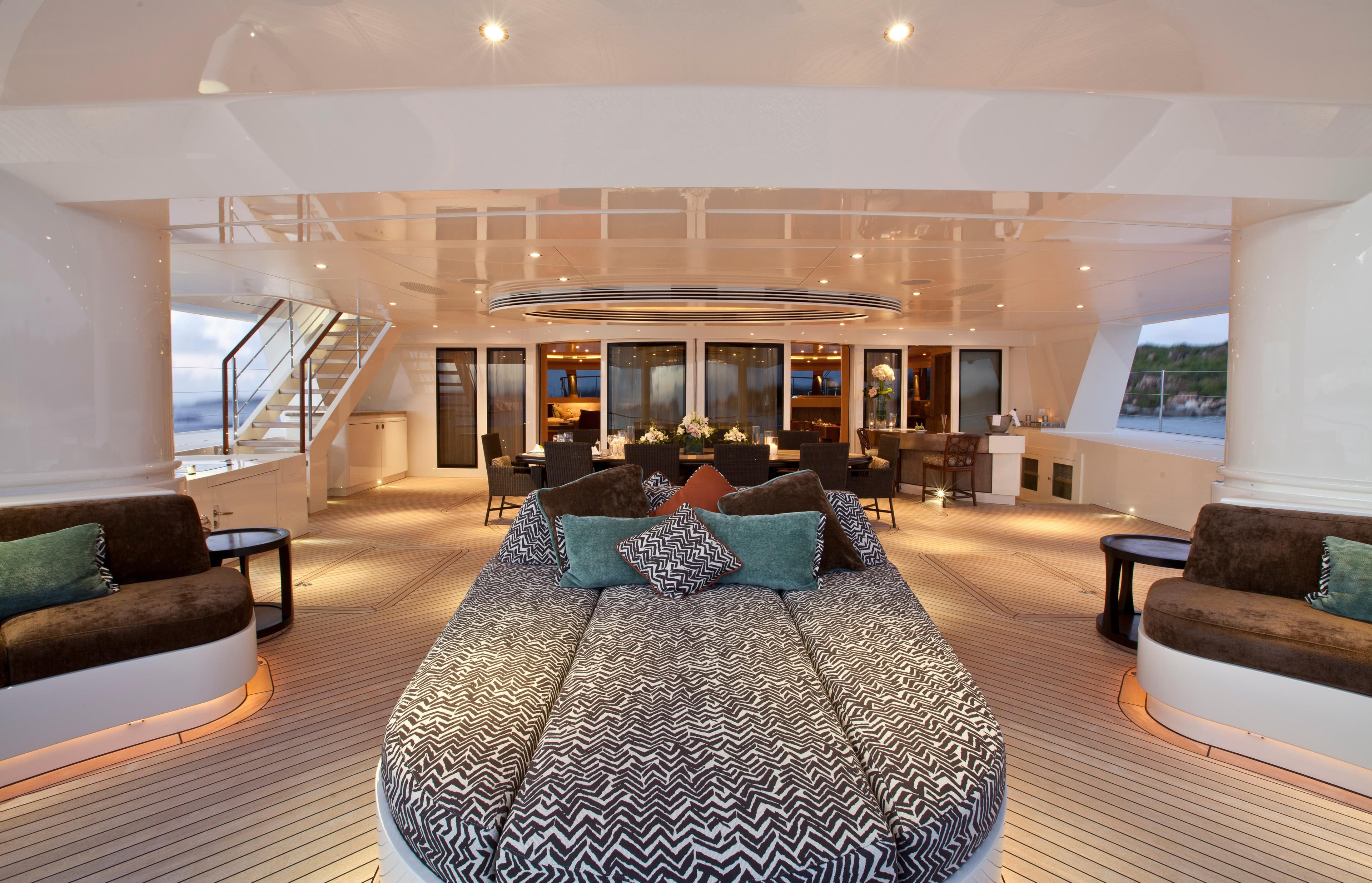Luxurious Pendennis Custom yacht interior with elegant seating, dining area, and ambient lighting, 2011 model.