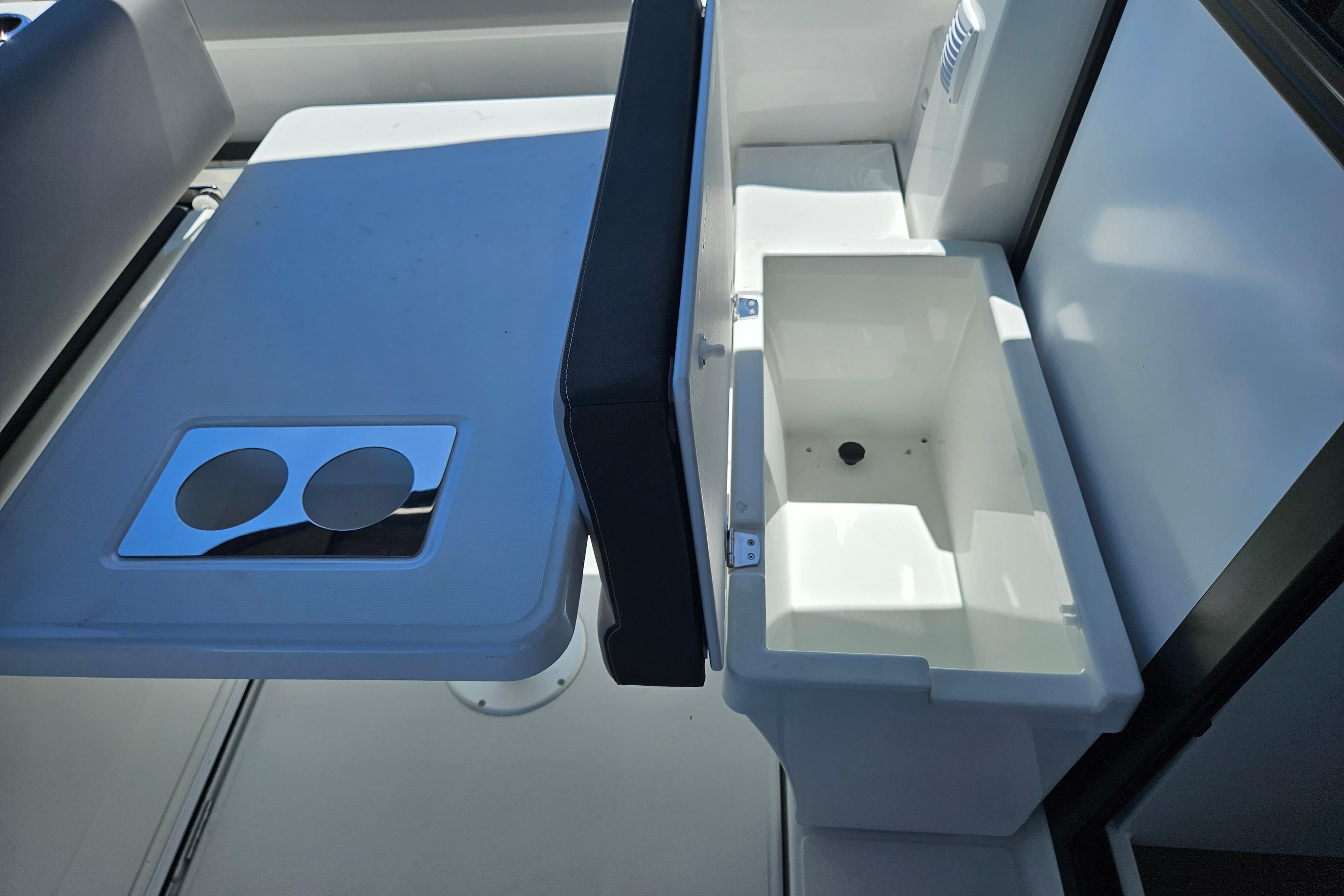 2026 Jeanneau NC 895 Sport Series 2 boat interior with table and storage compartment.