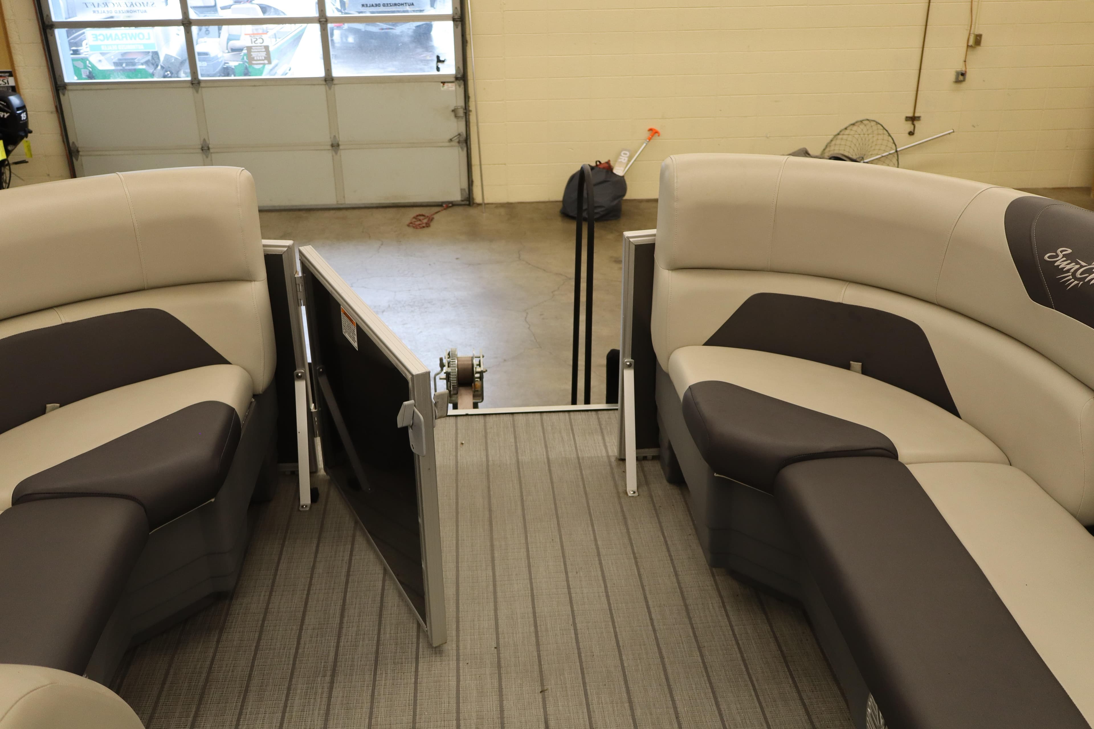 Interior of 2022 SunChaser Geneva Cruise 22 LR DH pontoon boat with plush seating.