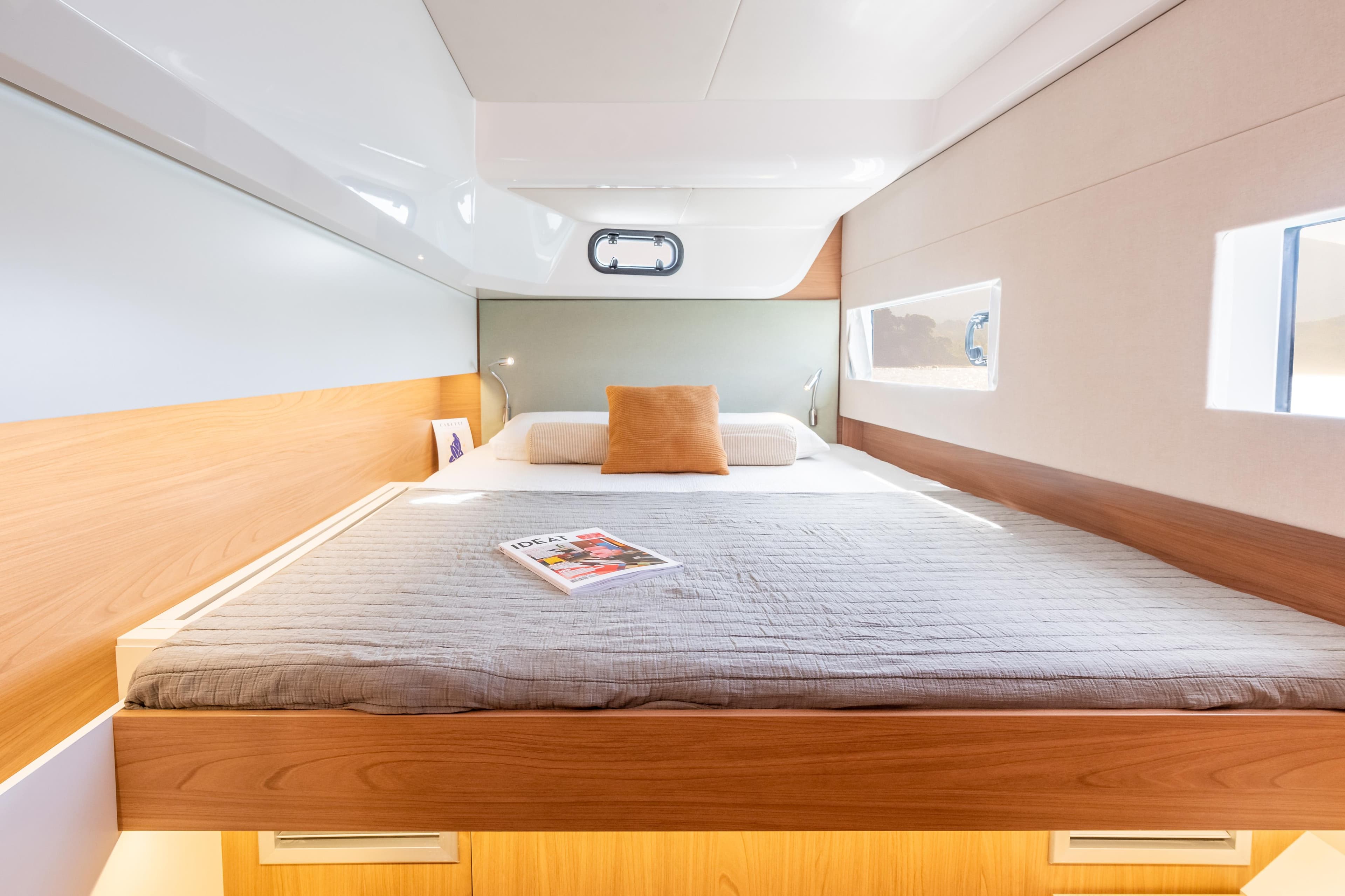 Luxurious cabin interior of 2026 Bali CATSMART yacht with cozy bed and modern design.