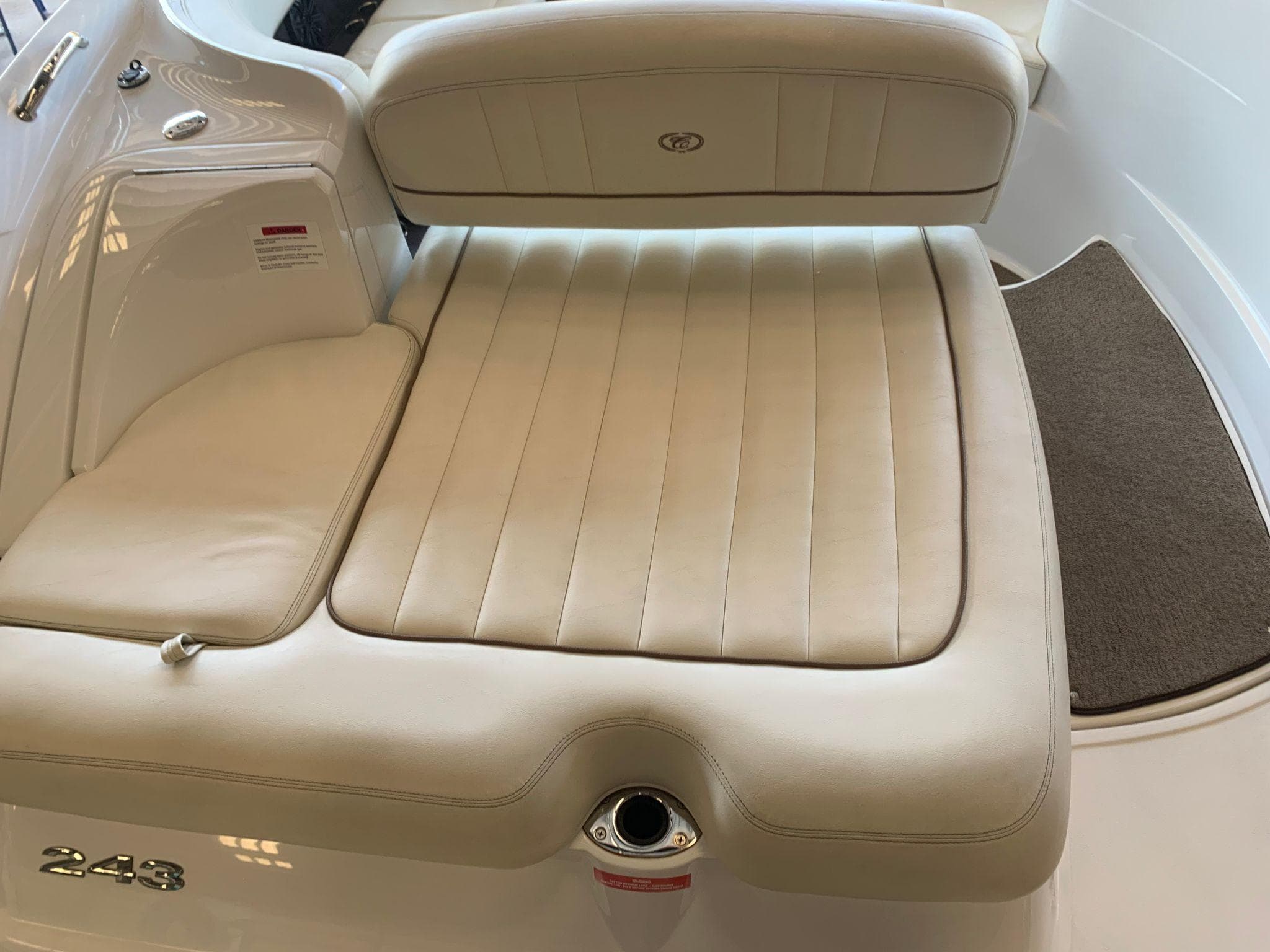Cobalt 243 boat 2015 with beige upholstered seat.