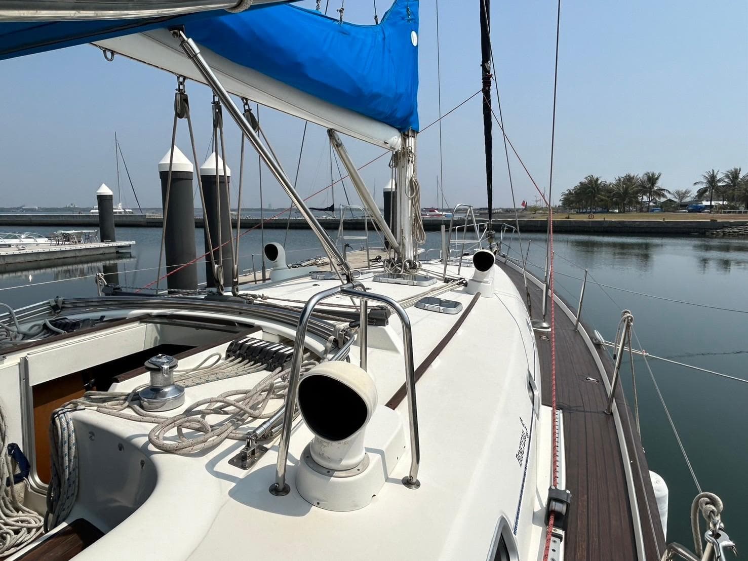 Beneteau Oceanis 50 sailboat, 1997 model, docked at marina with blue sail cover.
