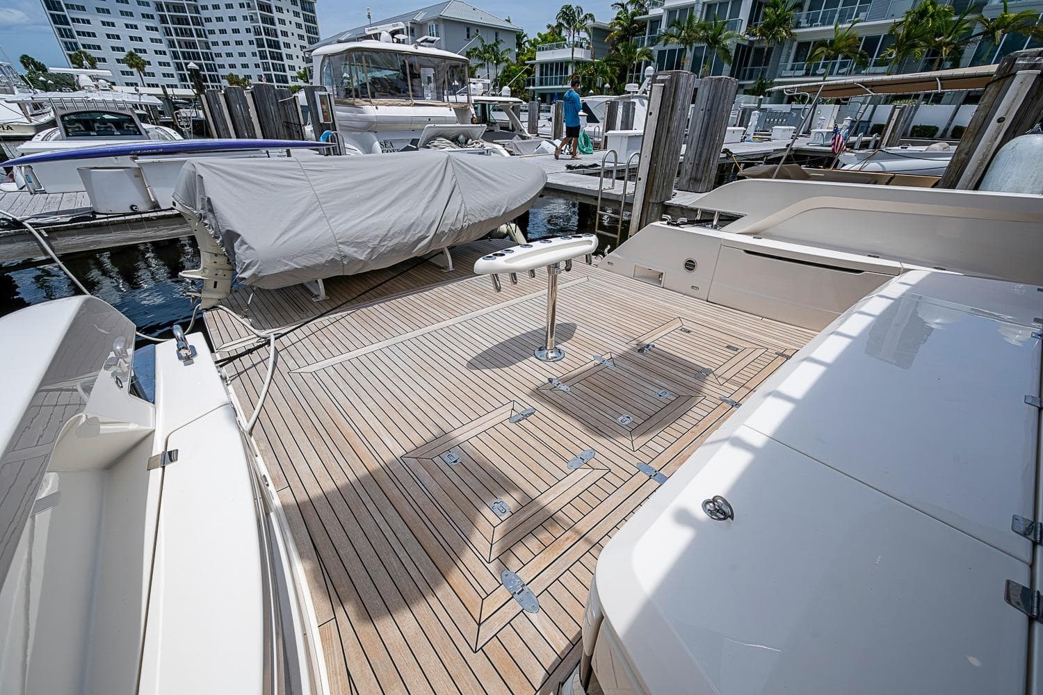 Luxury Maritimo M75 yacht deck, 2025 model, docked at marina with covered boat.