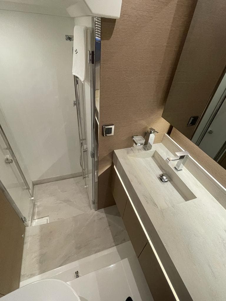 Luxurious bathroom on a 2022 Prestige 520 yacht.